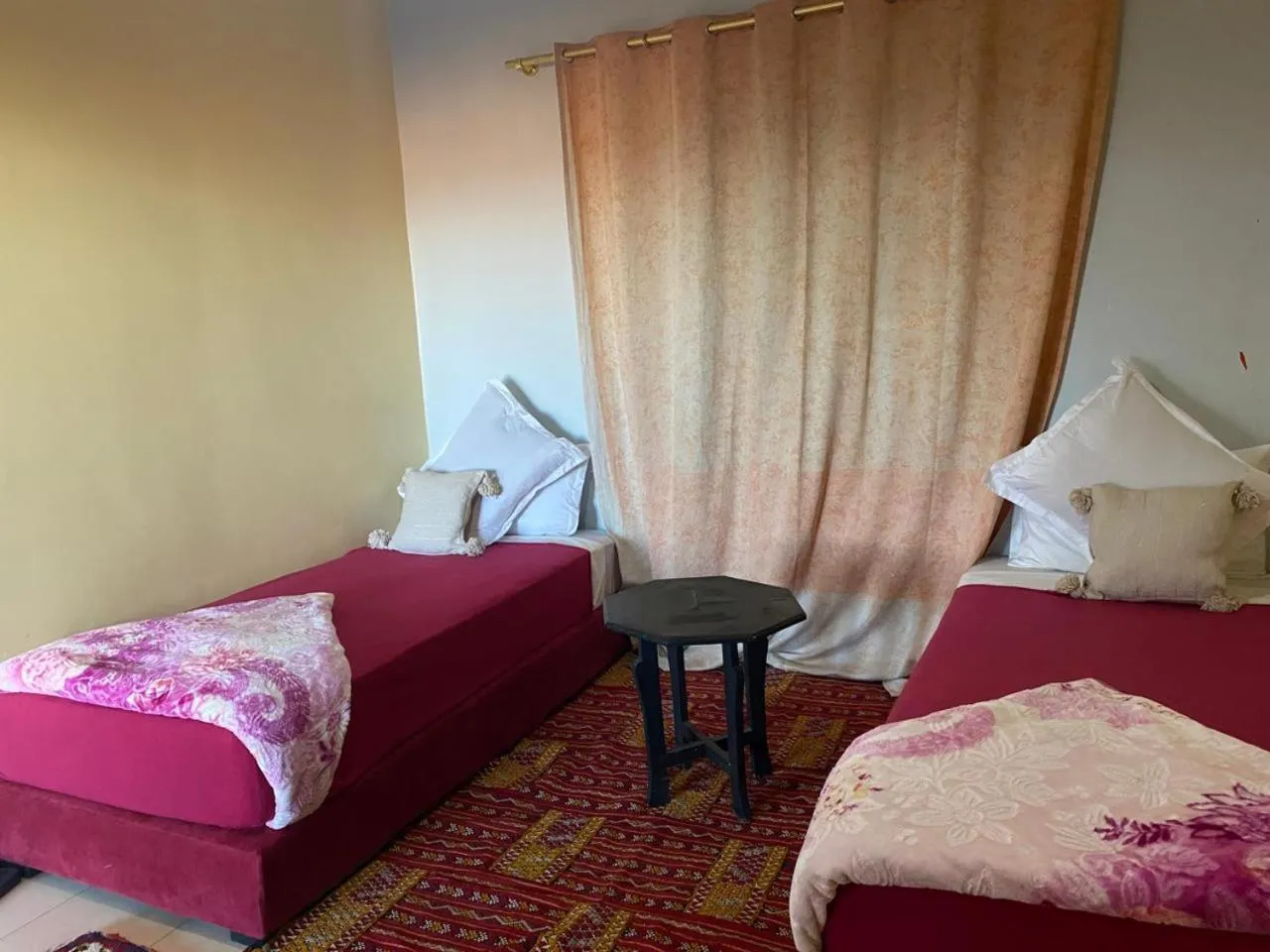 Bed in APPART AIGLE HOTEL