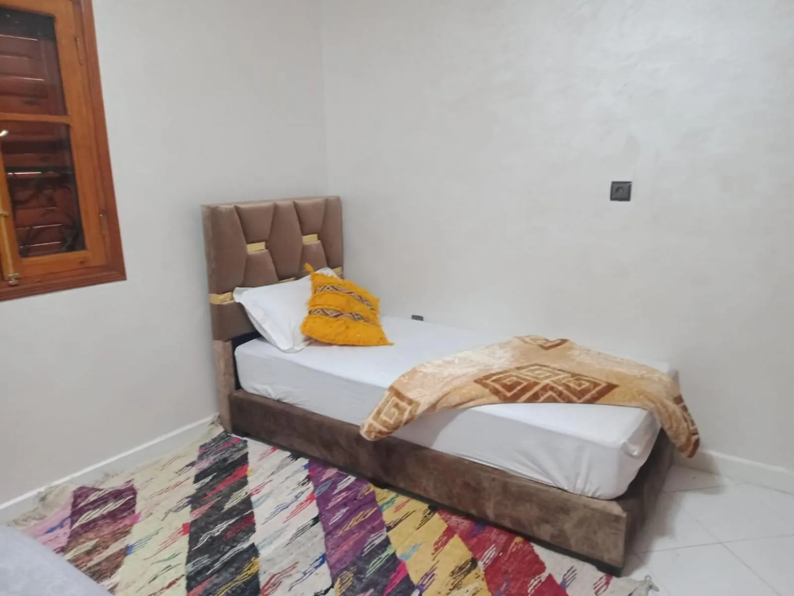 Bed in APPART AIGLE HOTEL