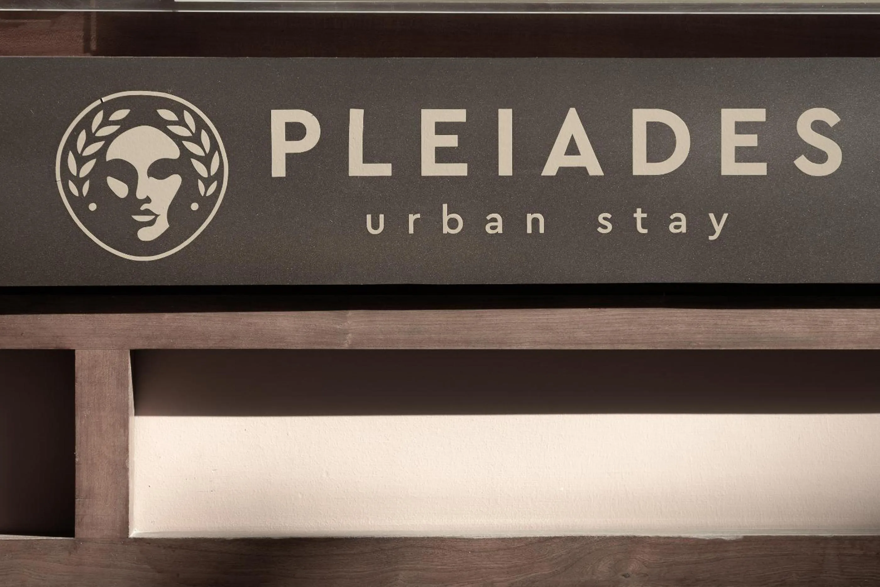 Property logo or sign in Pleiades Urban Stay by Semavί