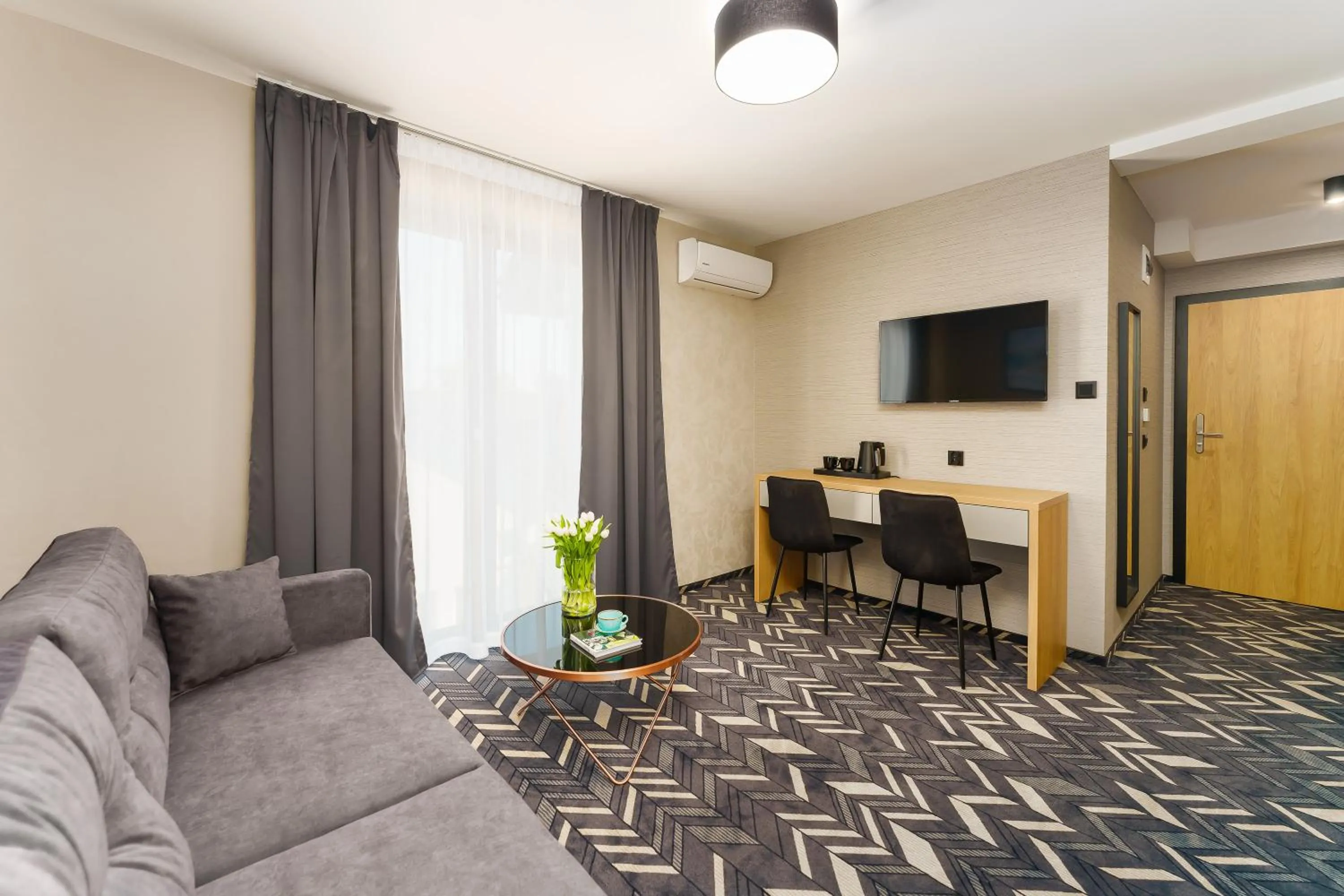 Communal lounge/ TV room in Mielno Hotel Boutique