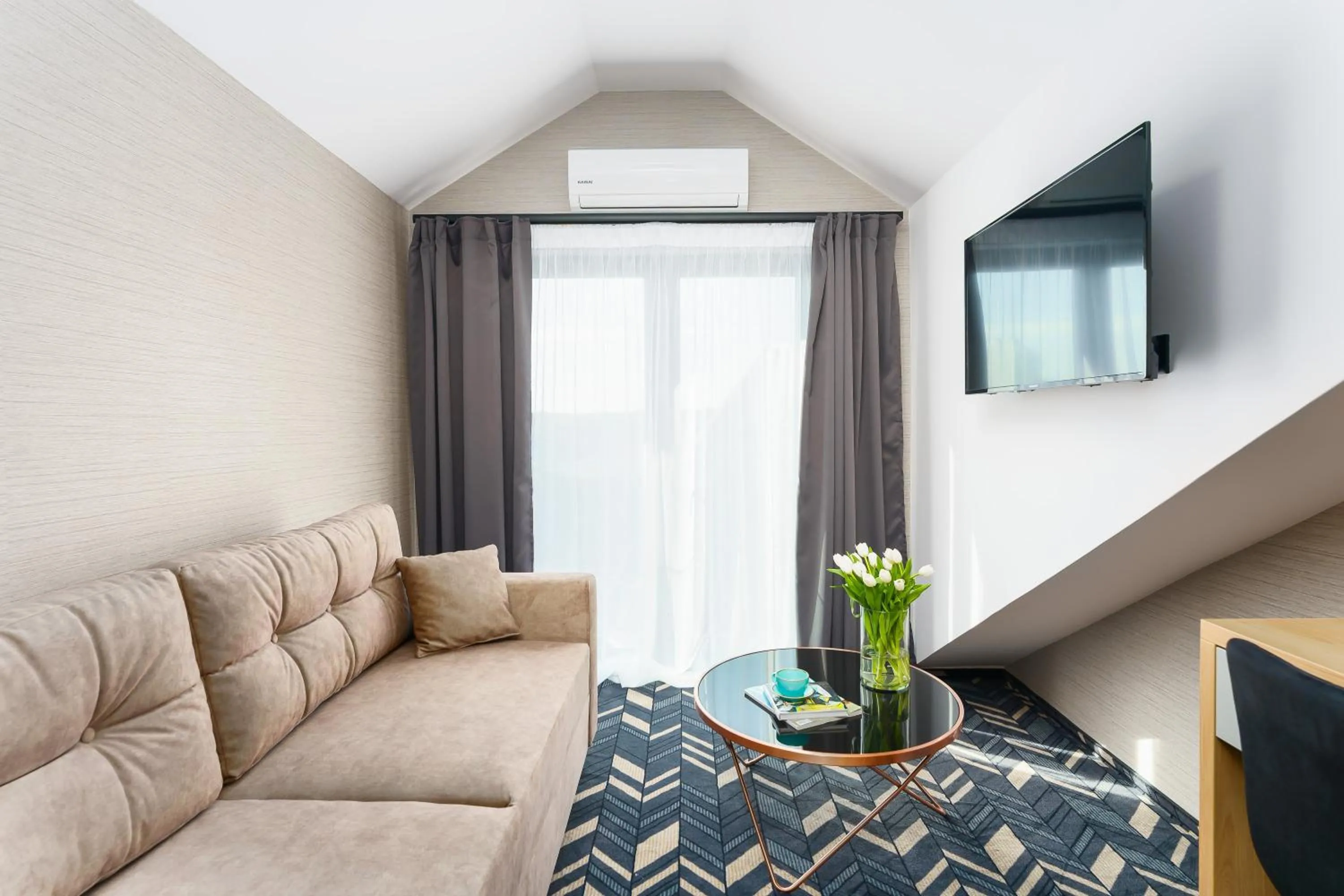 Communal lounge/ TV room in Mielno Hotel Boutique