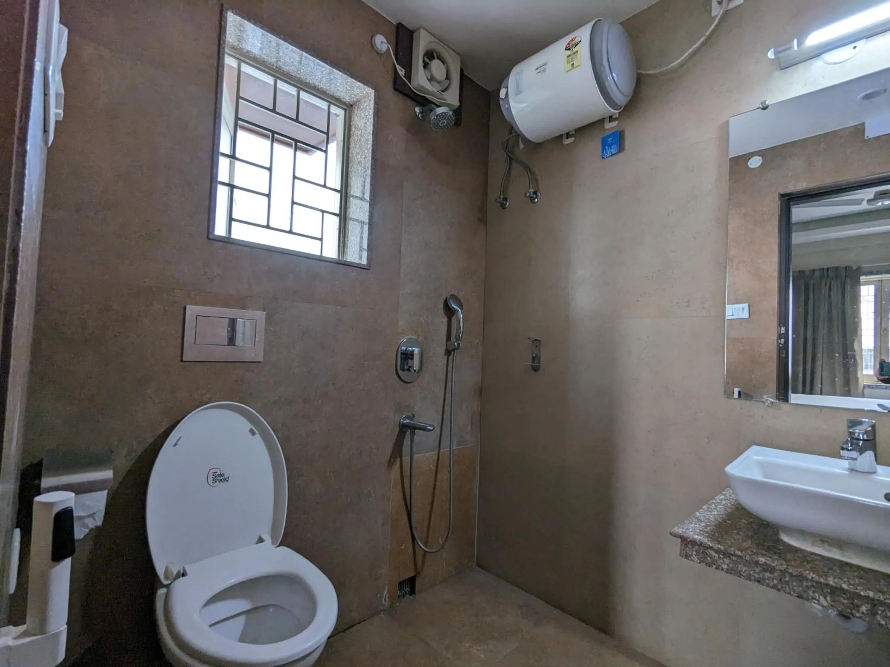 Bathroom in The Aster Enclave Hotel