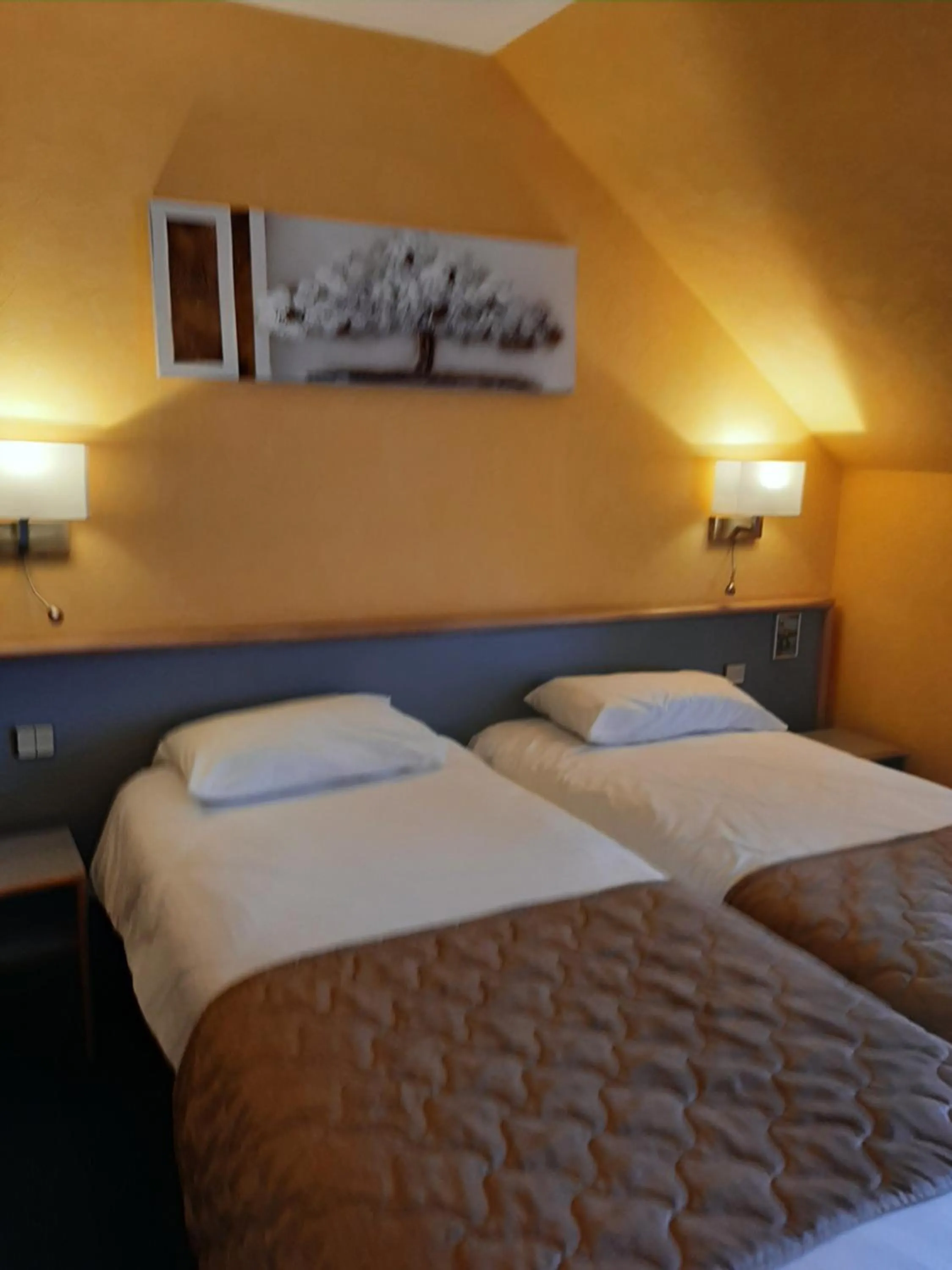 Bed in Au Relais de l'Oust