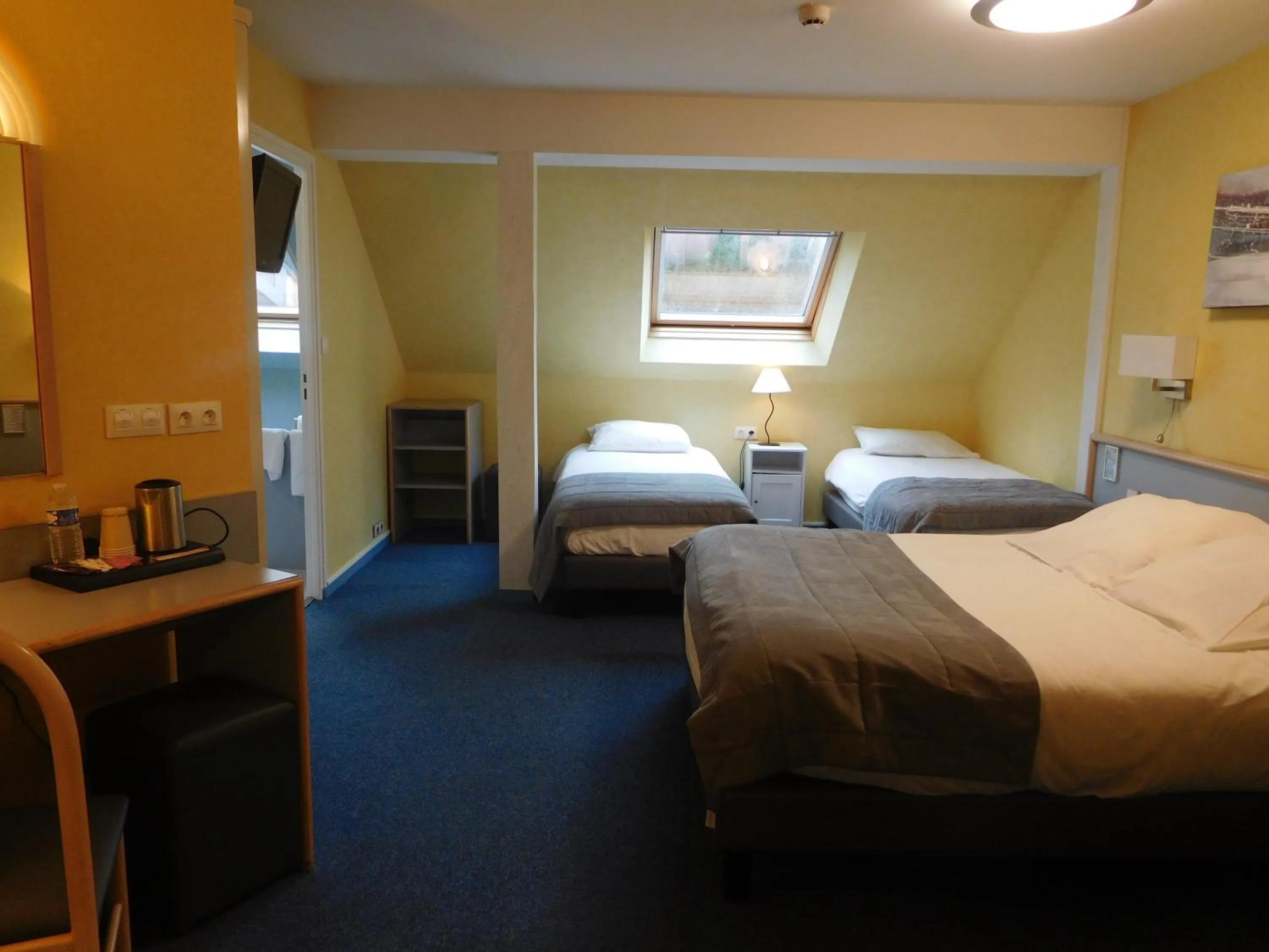 Bed in Au Relais de l'Oust