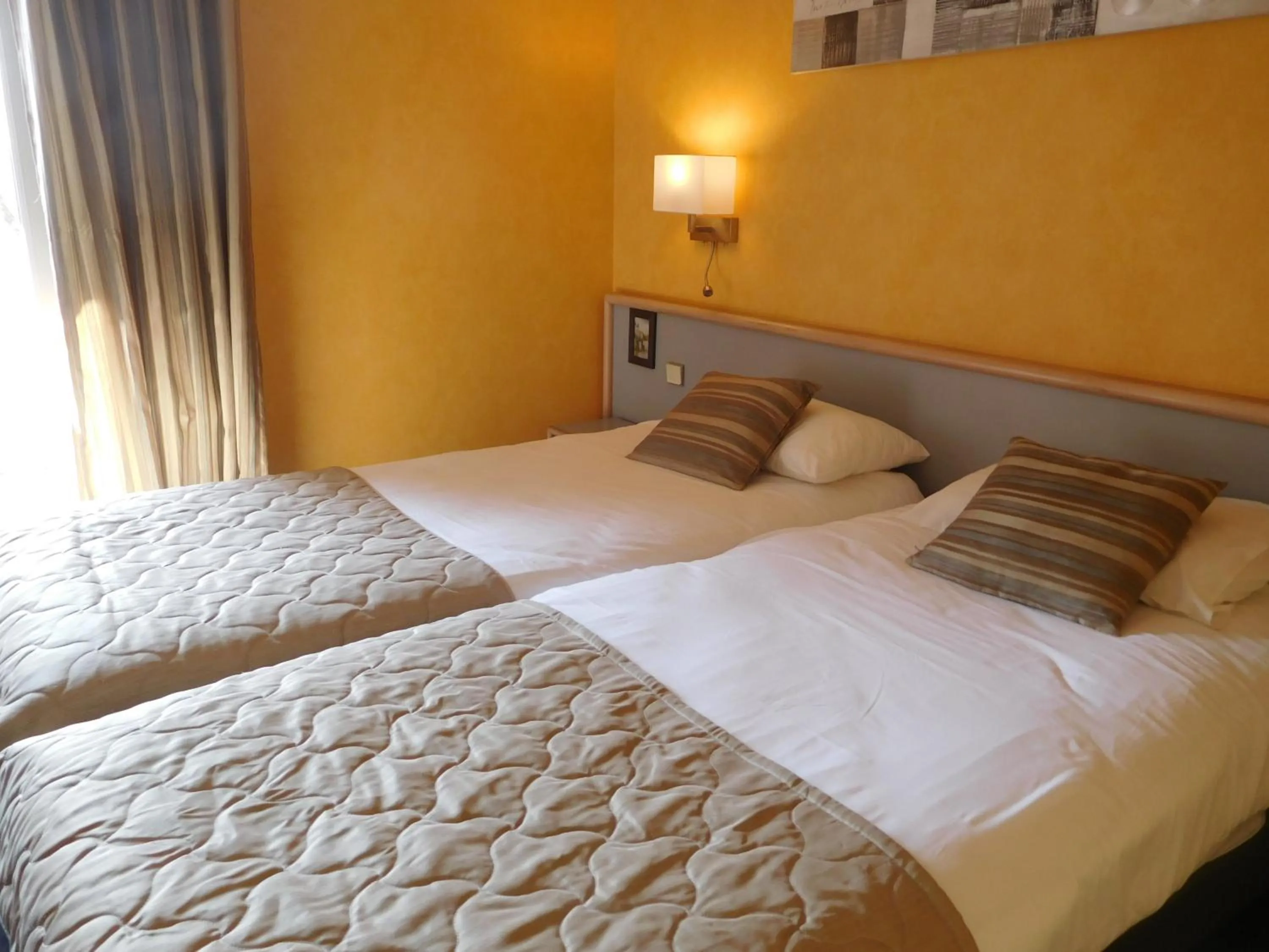 Bed in Au Relais de l'Oust