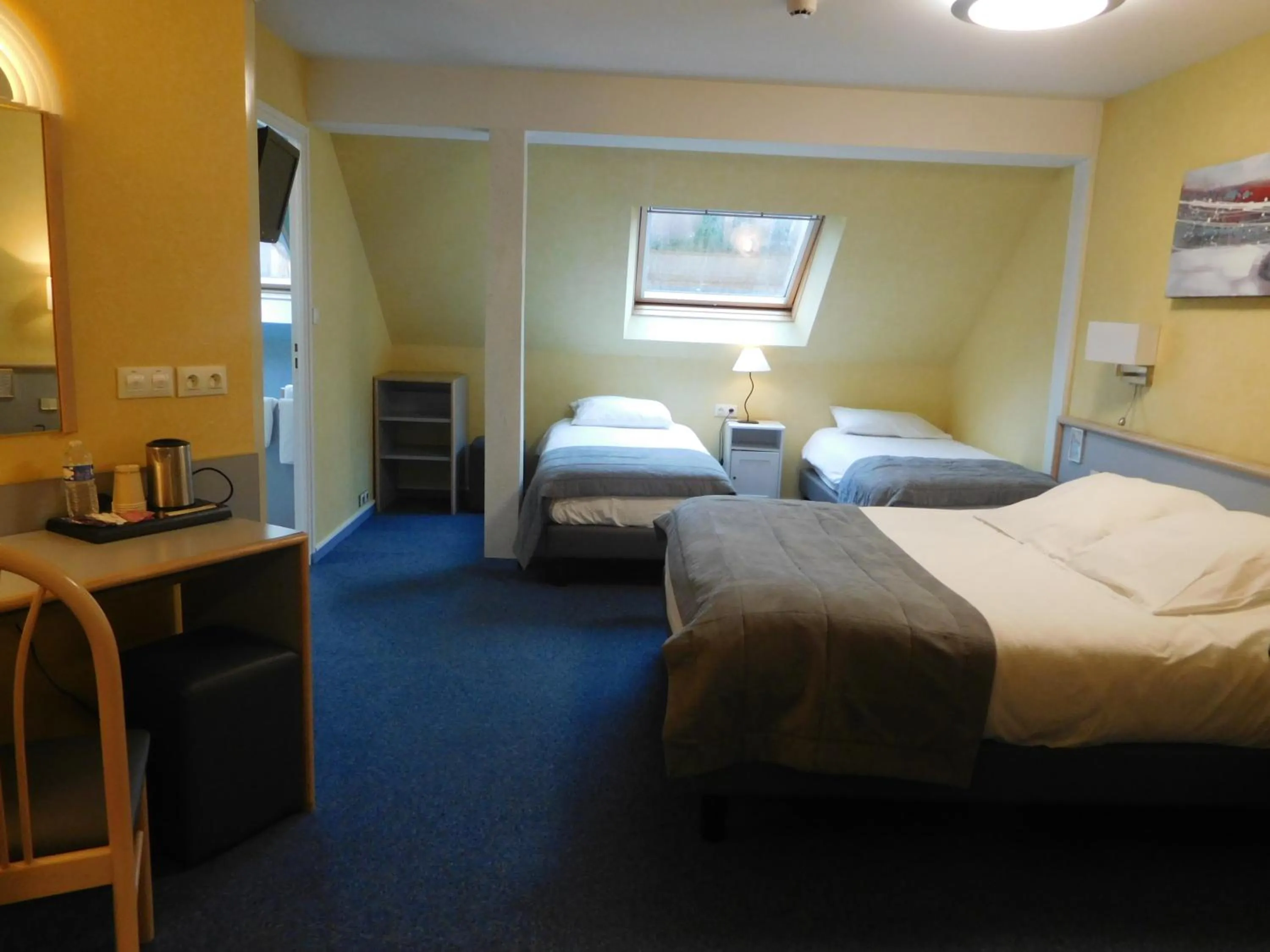 Bed in Au Relais de l'Oust