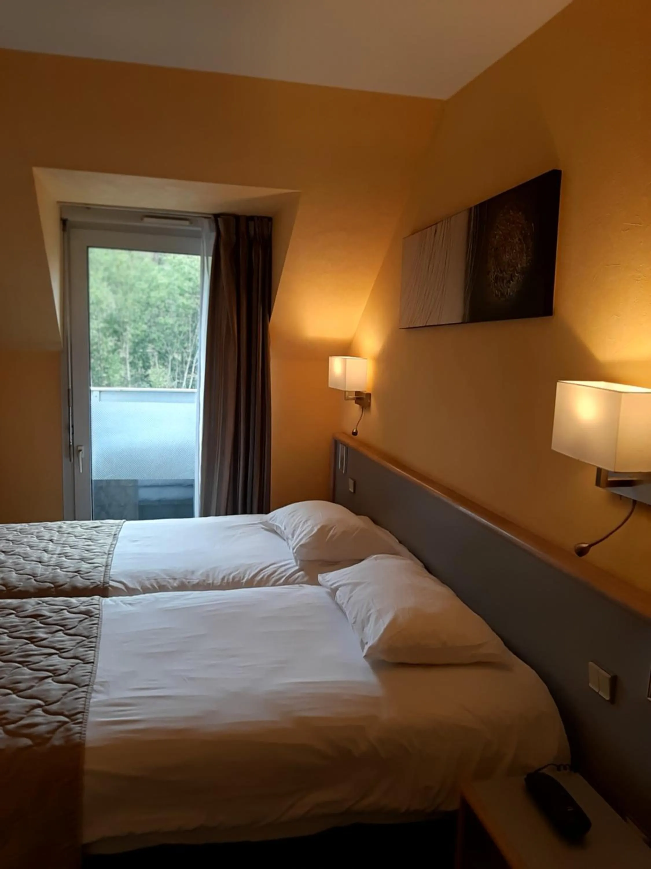 Bed in Au Relais de l'Oust