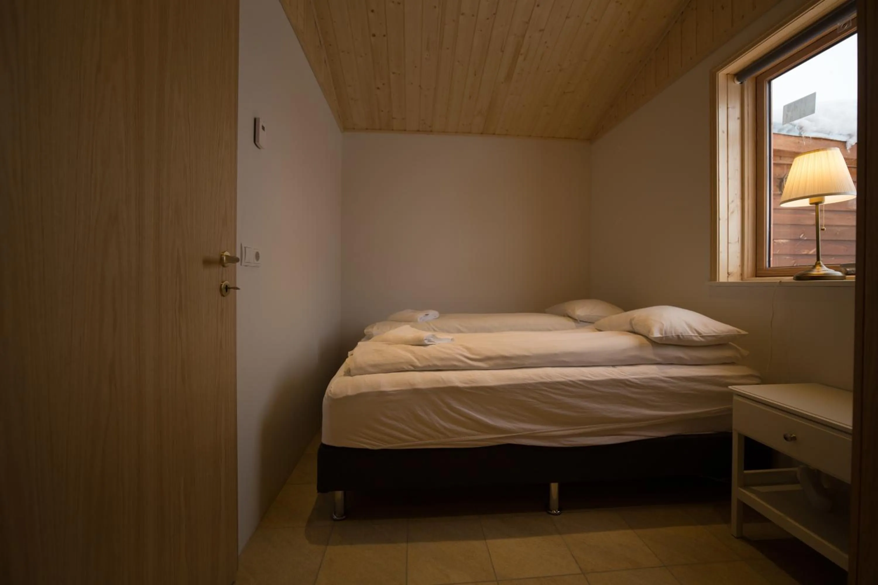 Bed in Dimmuborgir Guesthouse