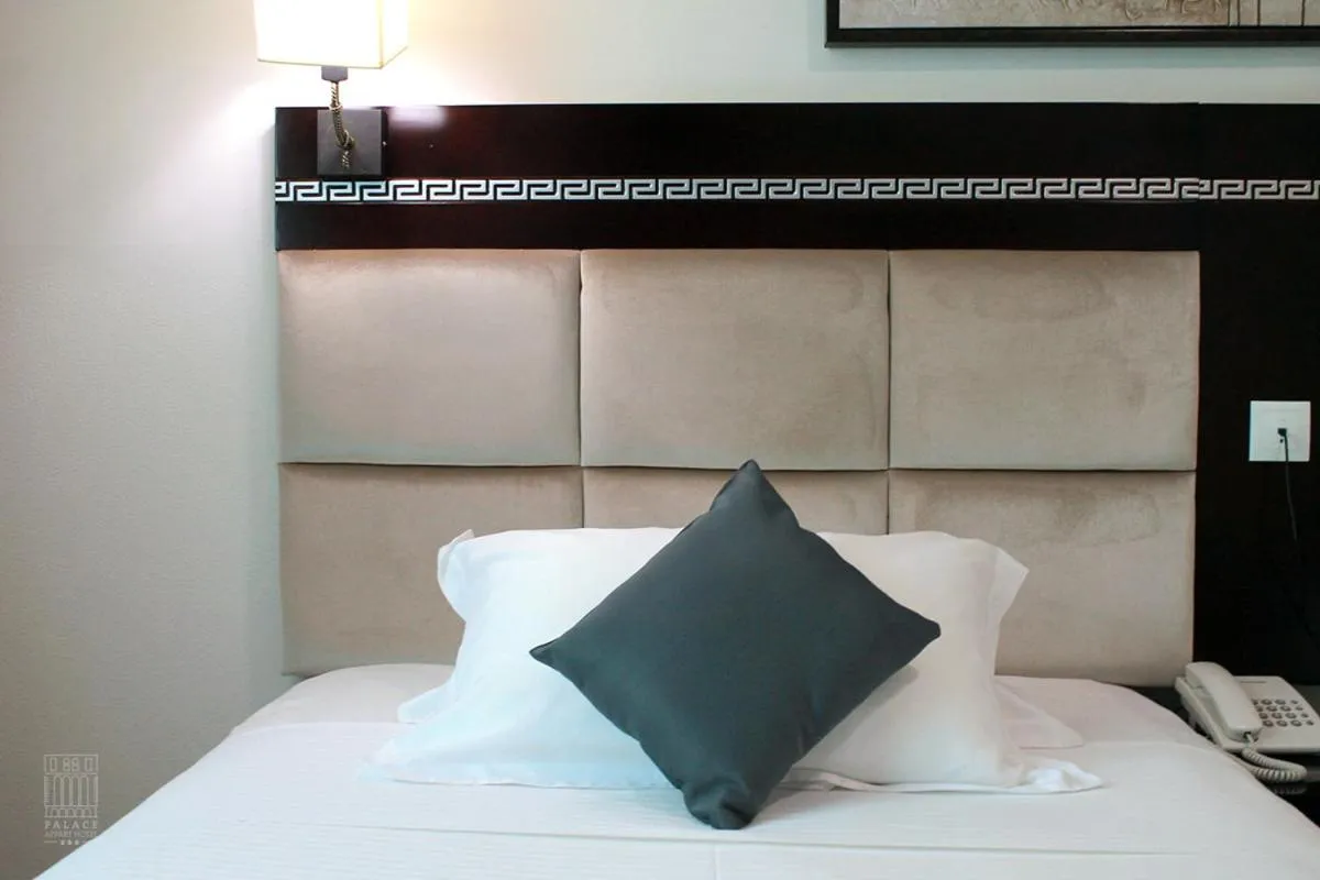 Bed in PALACE APPART HOTEL