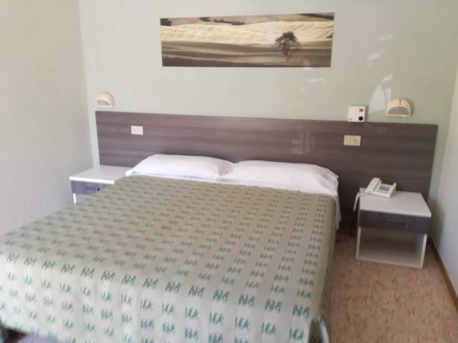 Bed in Hotel Saturno