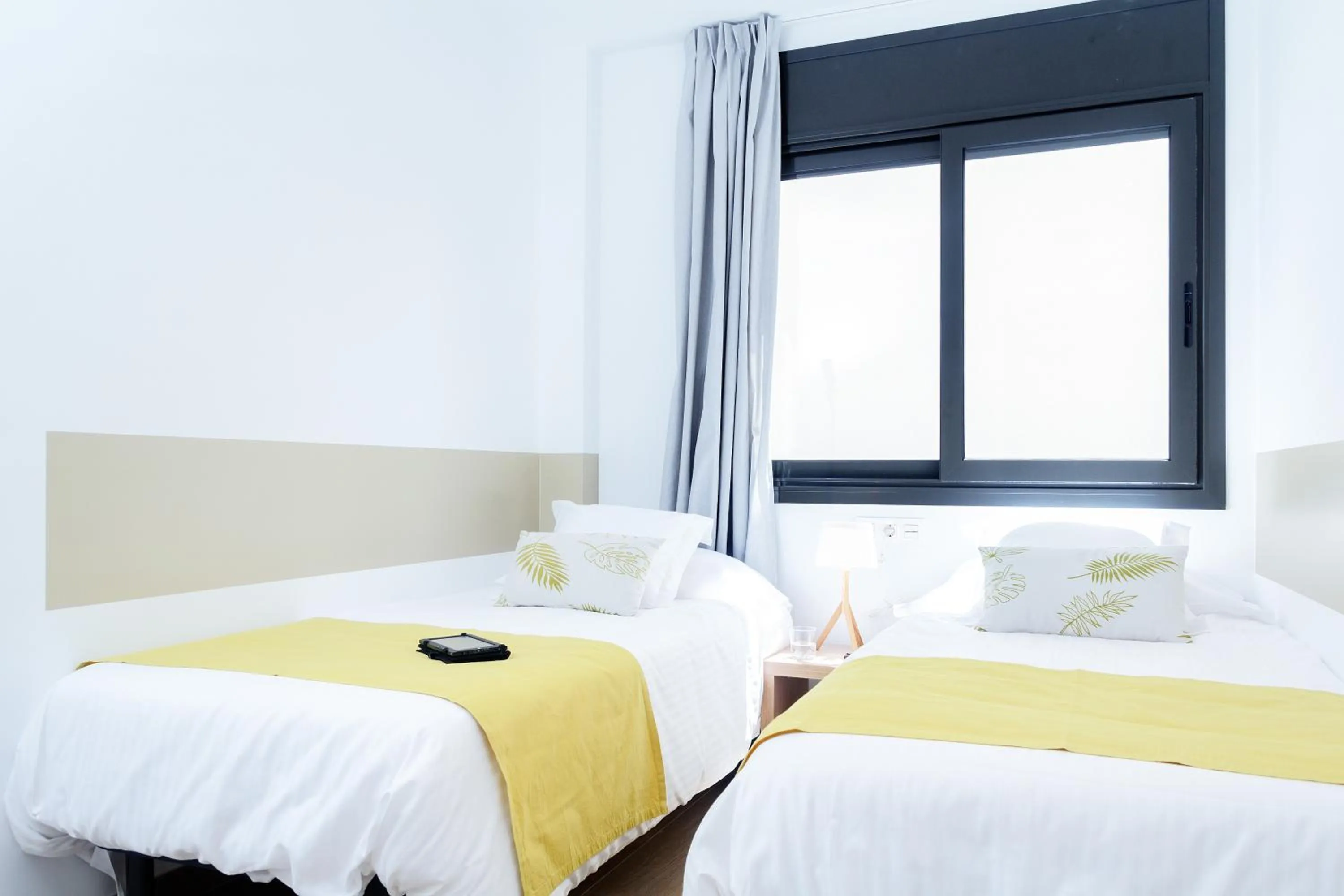 Bed in Feelathome Plaza Apartments