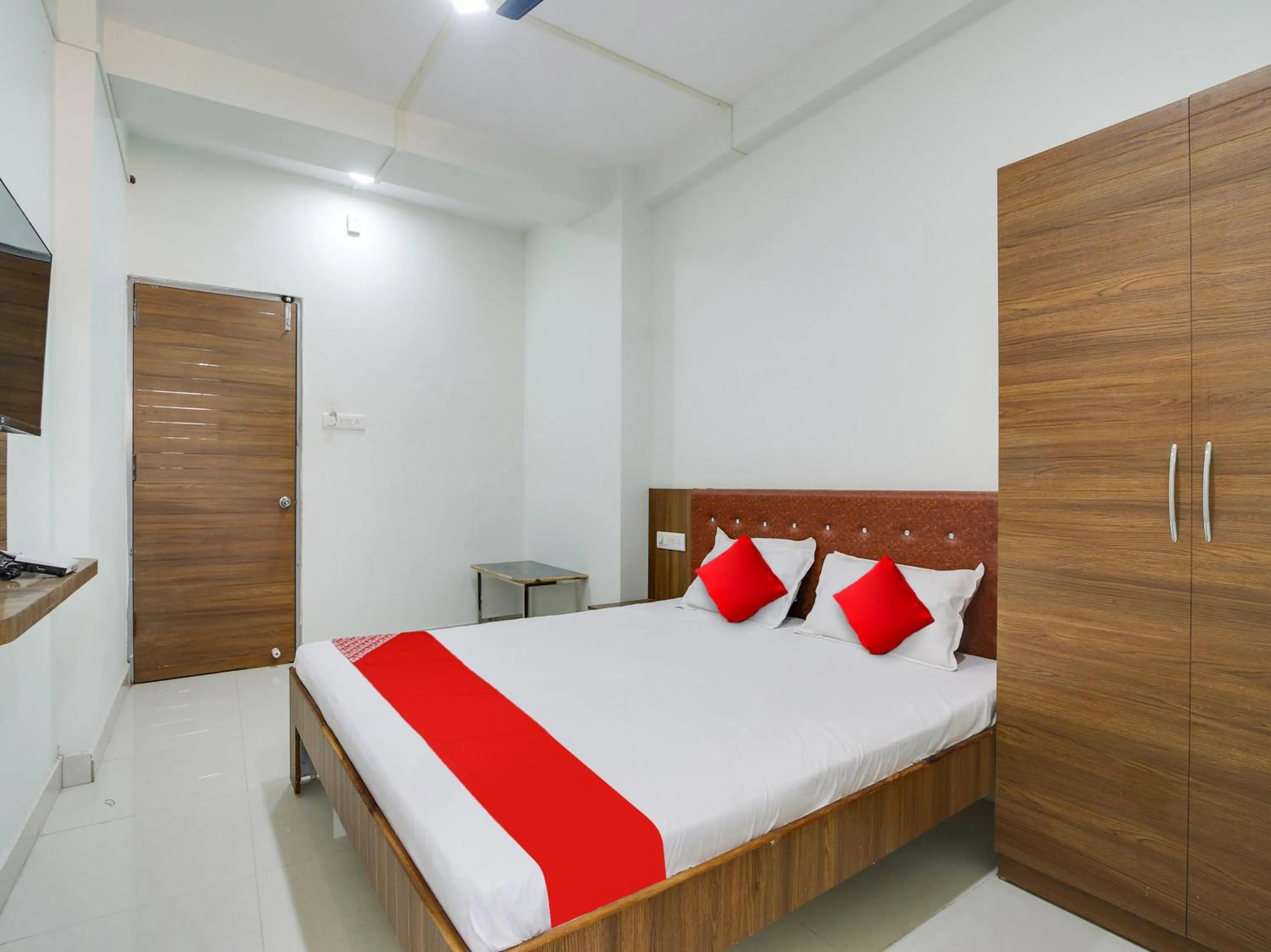 Bedroom in Super Hotel O Lalit And Marriage Garden