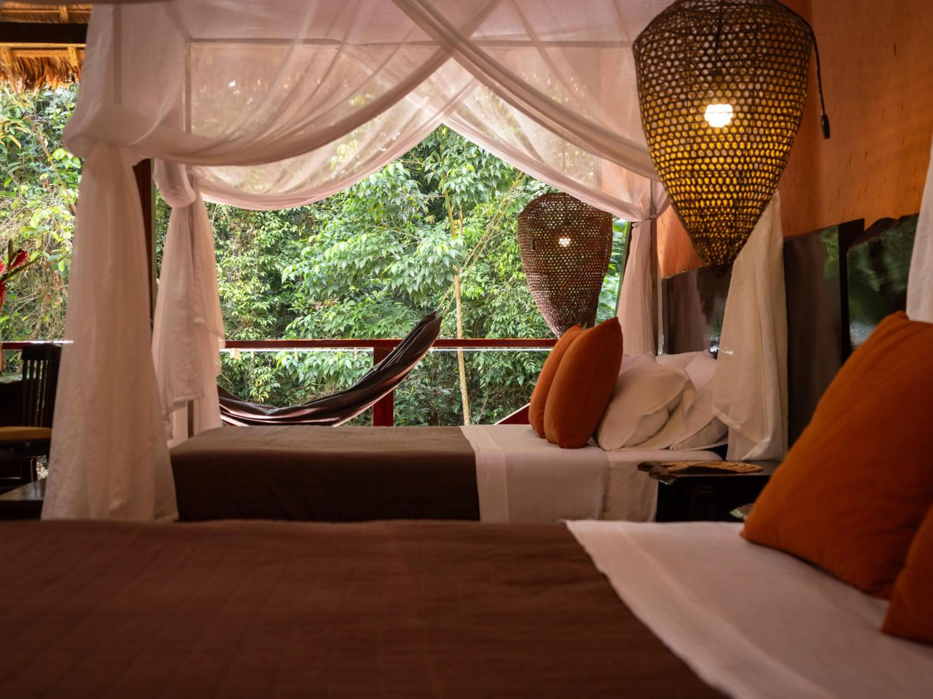 Bed in Refugio Amazonas Lodge