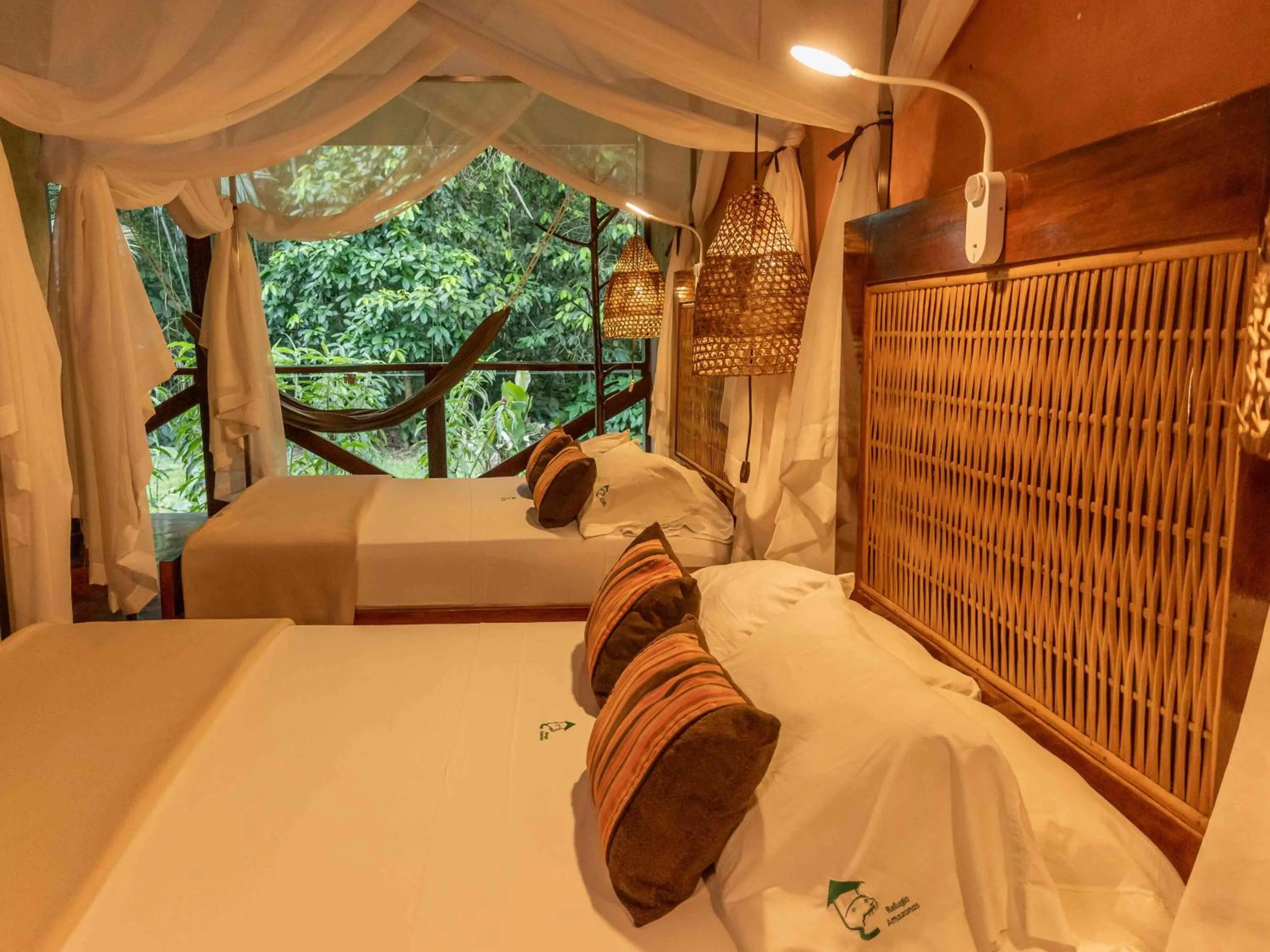 Bed in Refugio Amazonas Lodge