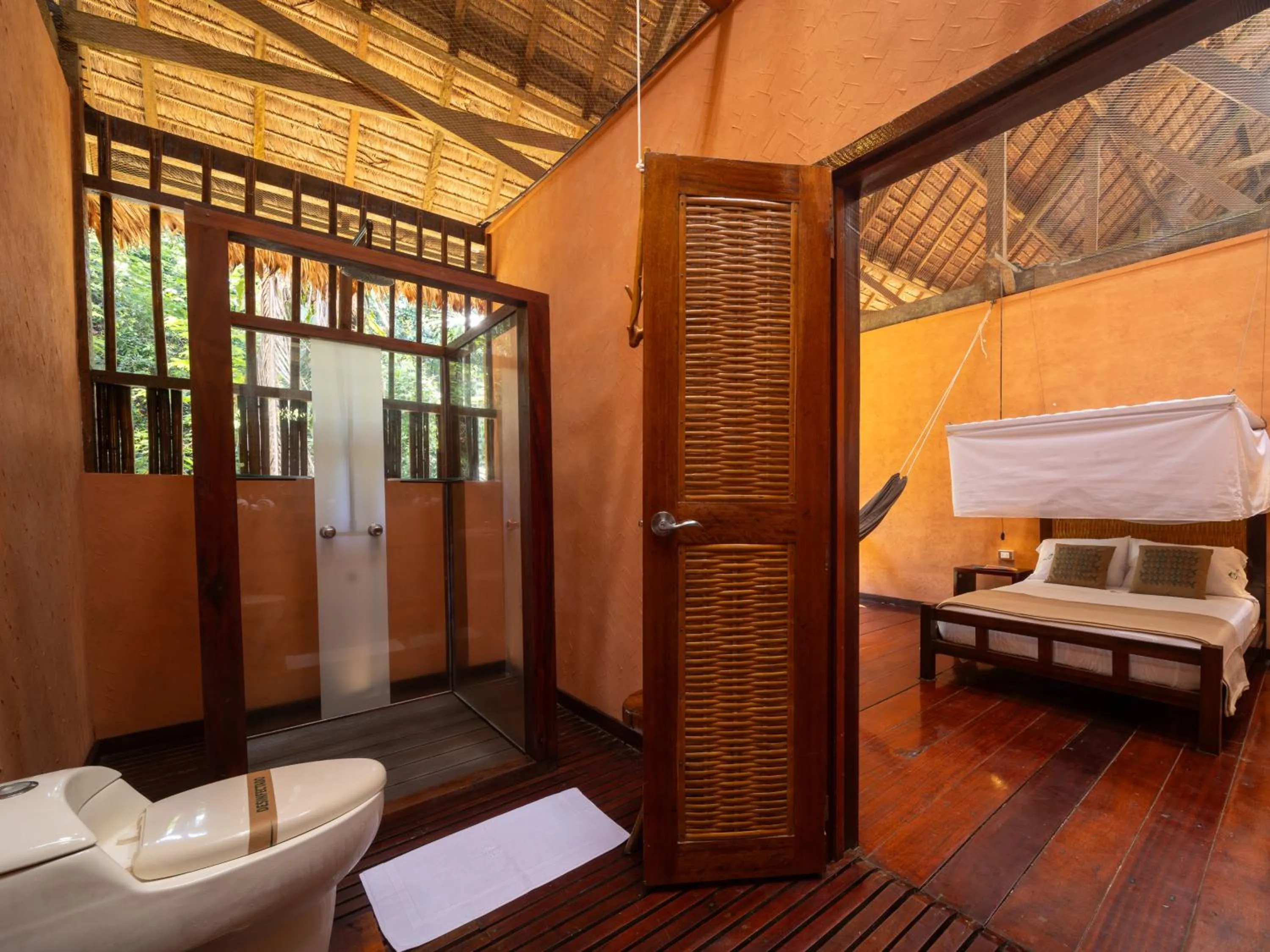 Toilet, Bed in Refugio Amazonas Lodge
