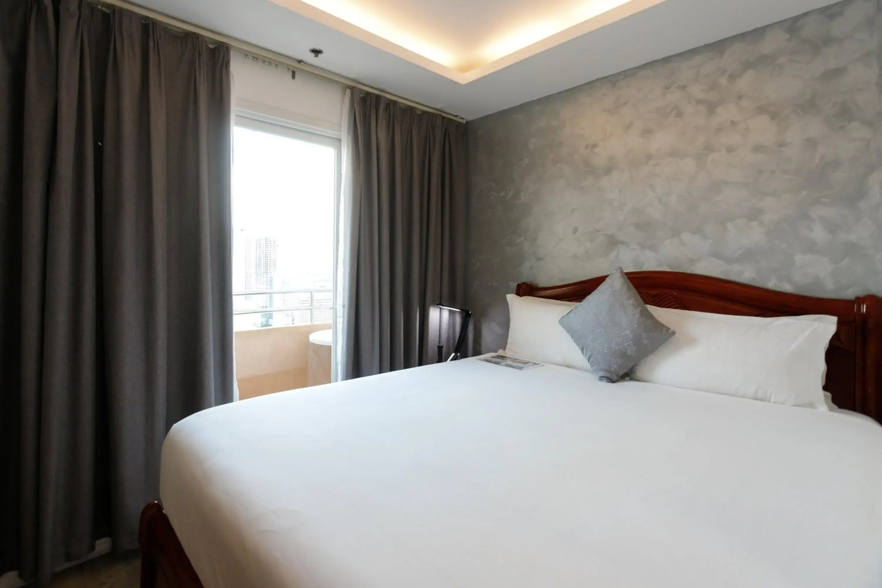 Bed in Regency Grand Suites Bed in Regency Grand Suites