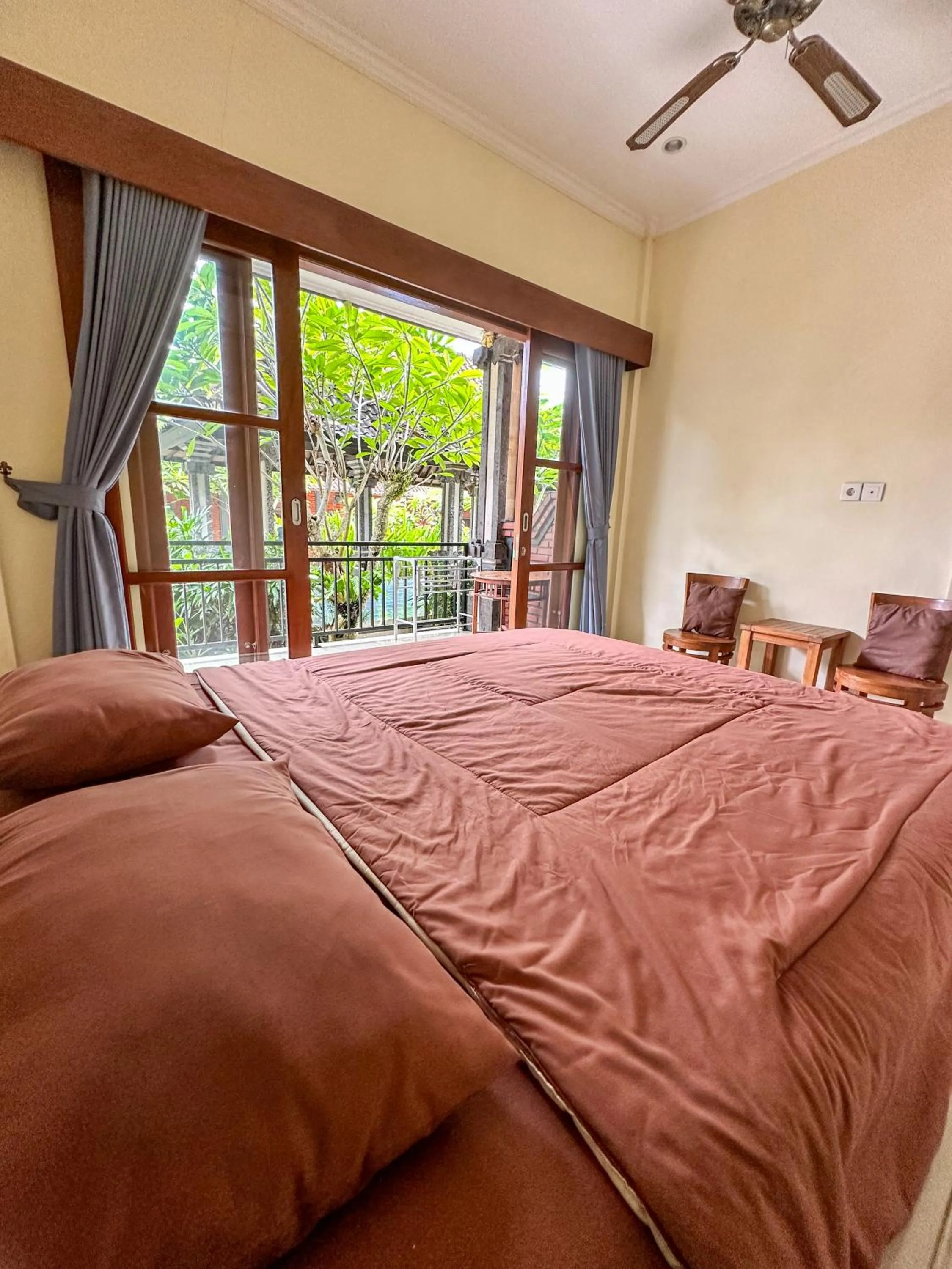 Bed in Ojek's Homestay