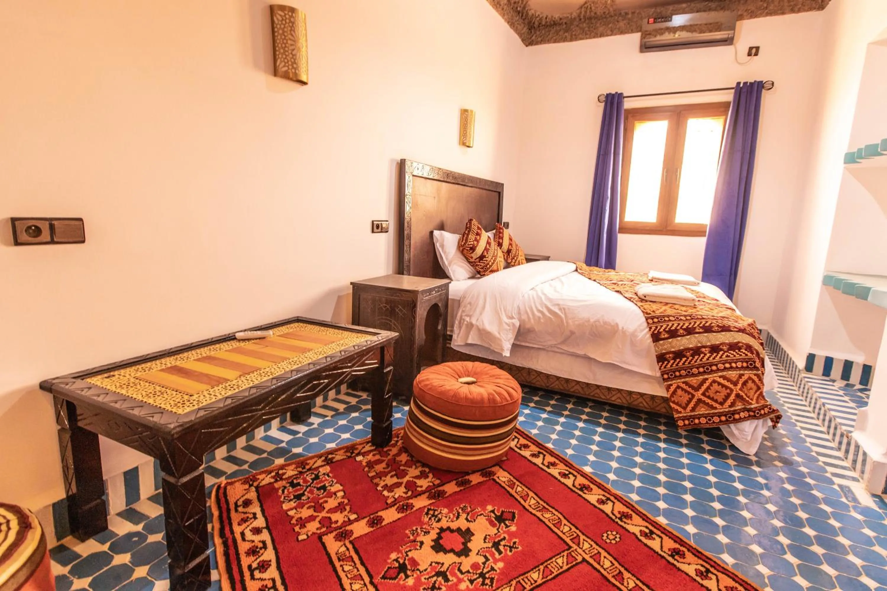 Bed in Riad Merzouga Dunes