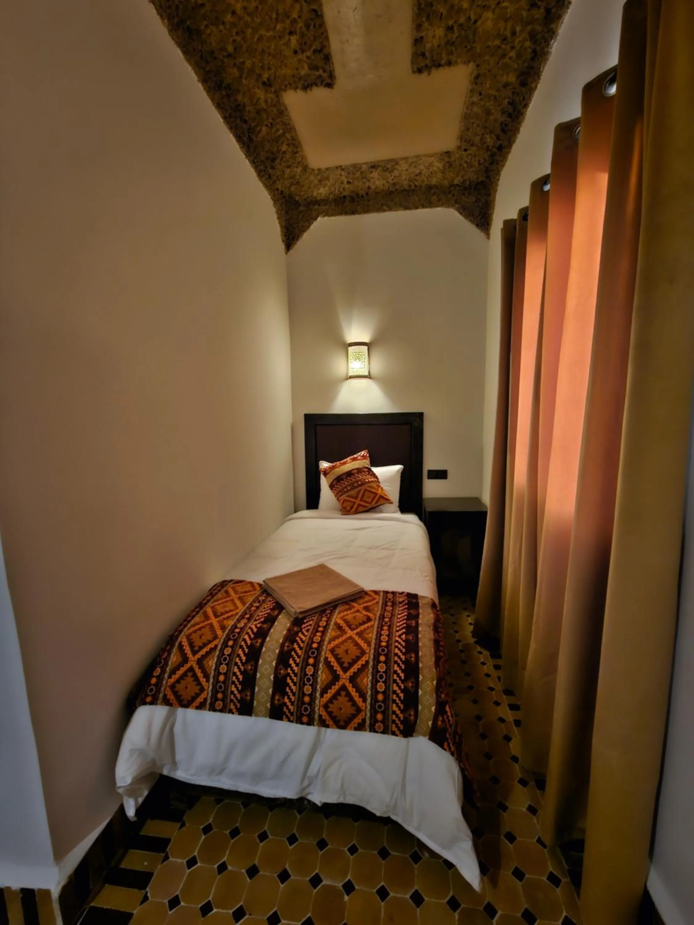 Bed in Riad Merzouga Dunes