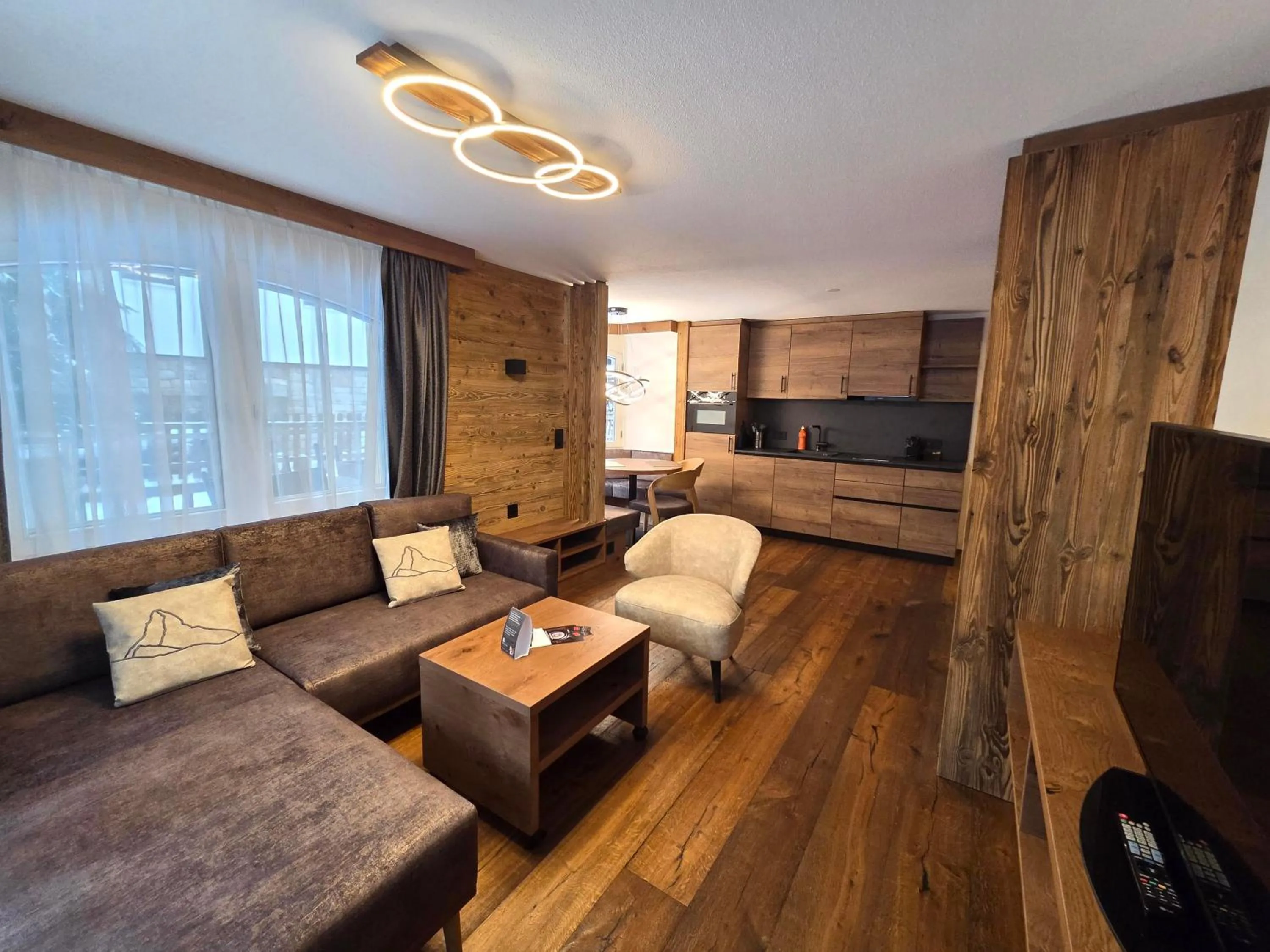 Communal lounge/ TV room in La Perle Apartments