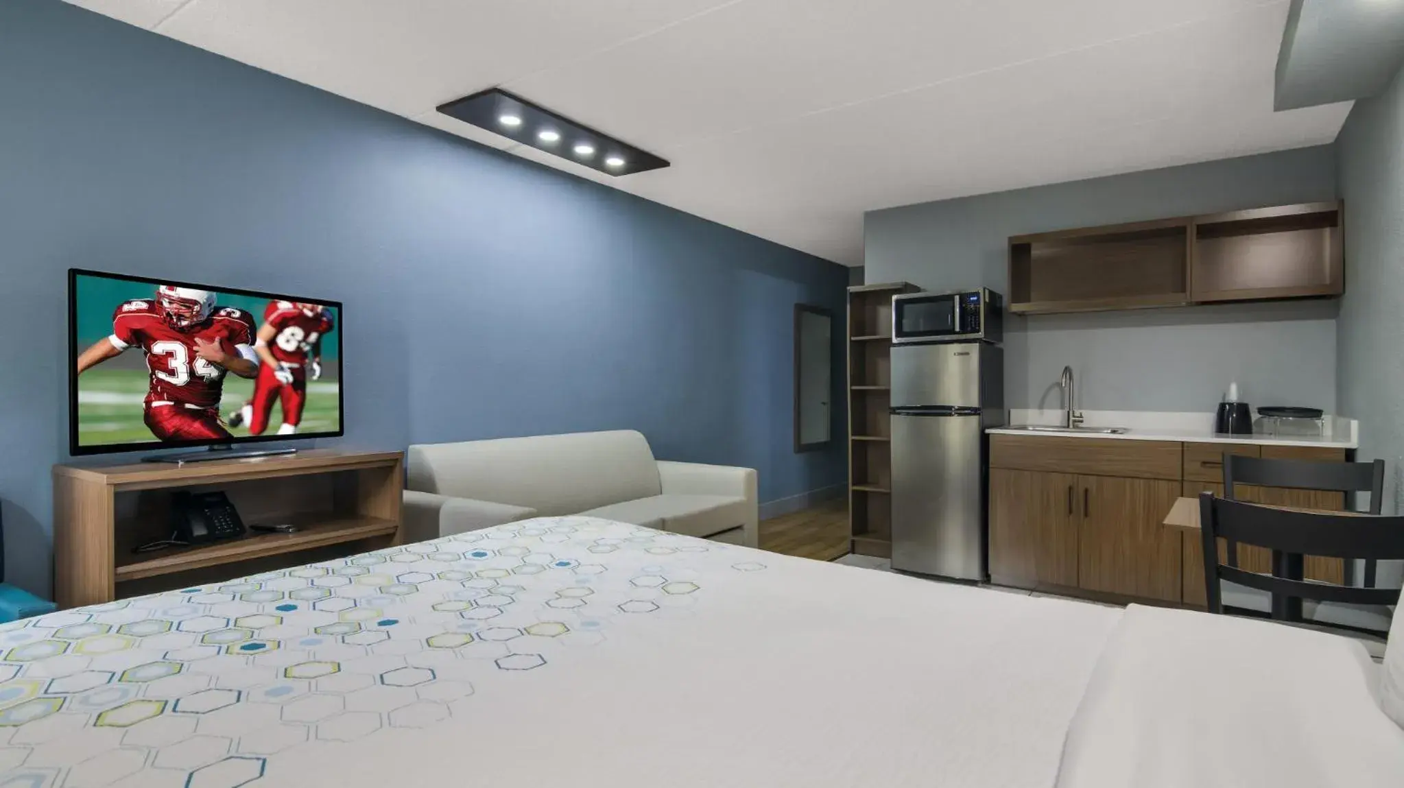 Bedroom, Bed in HomeTowne Studios by Red Roof and Conference Center Chicago - N Aurora Naperville Bedroom, Bed in HomeTowne Studios by Red Roof and Conference Center Chicago - N Aurora Naperville