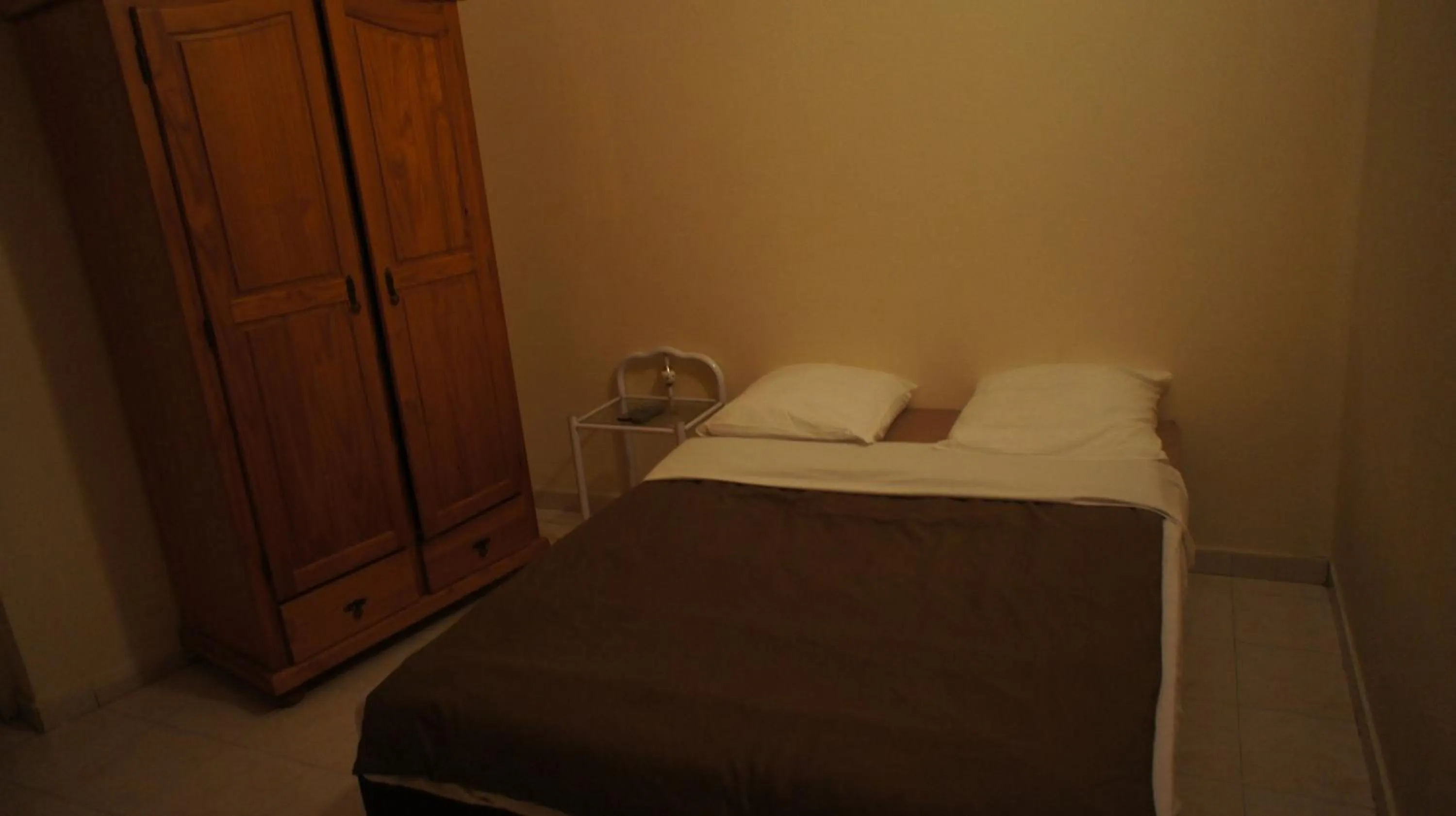 Bed in Hôtel de la Renaissance