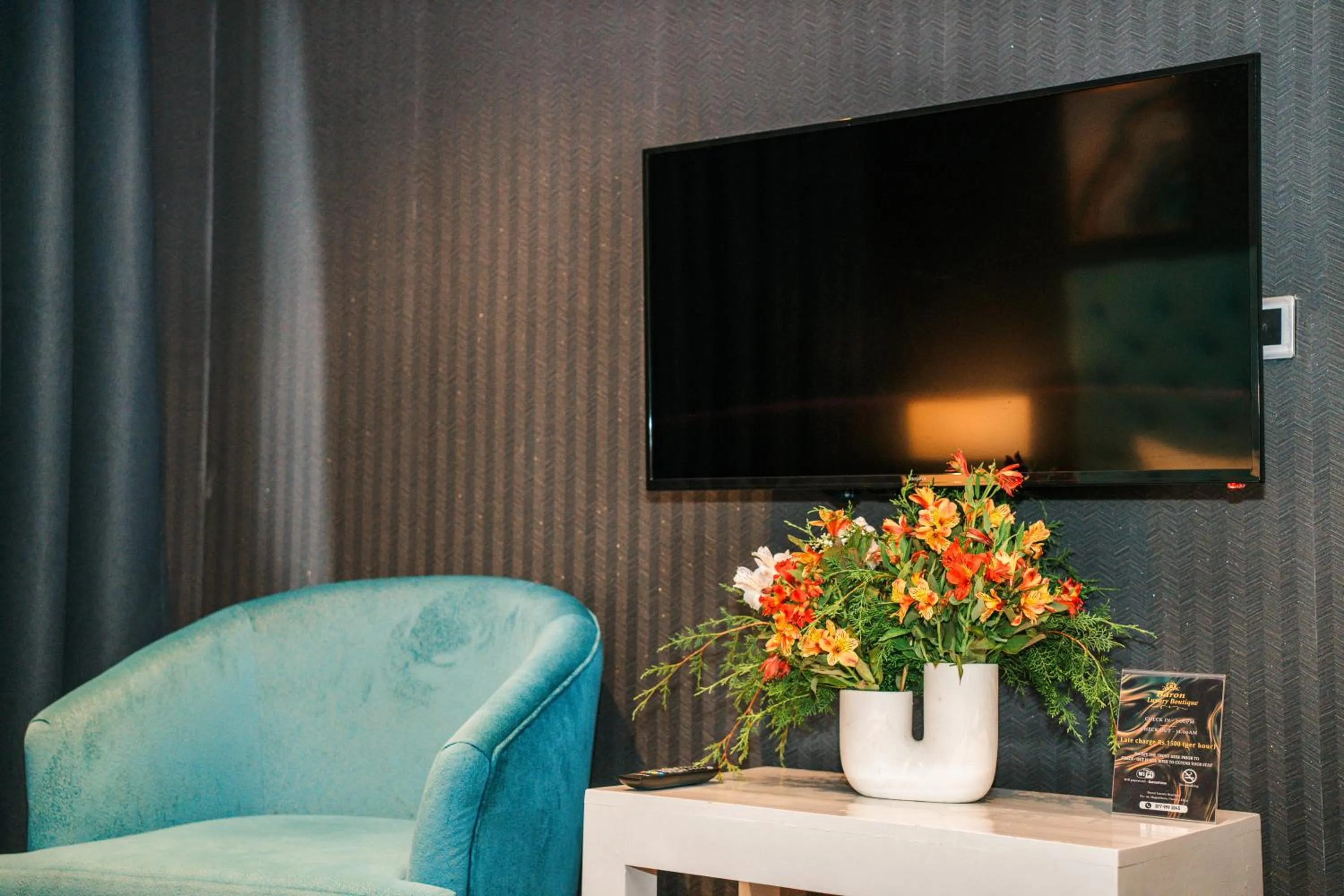 Communal lounge/ TV room in Baron Luxury Boutique