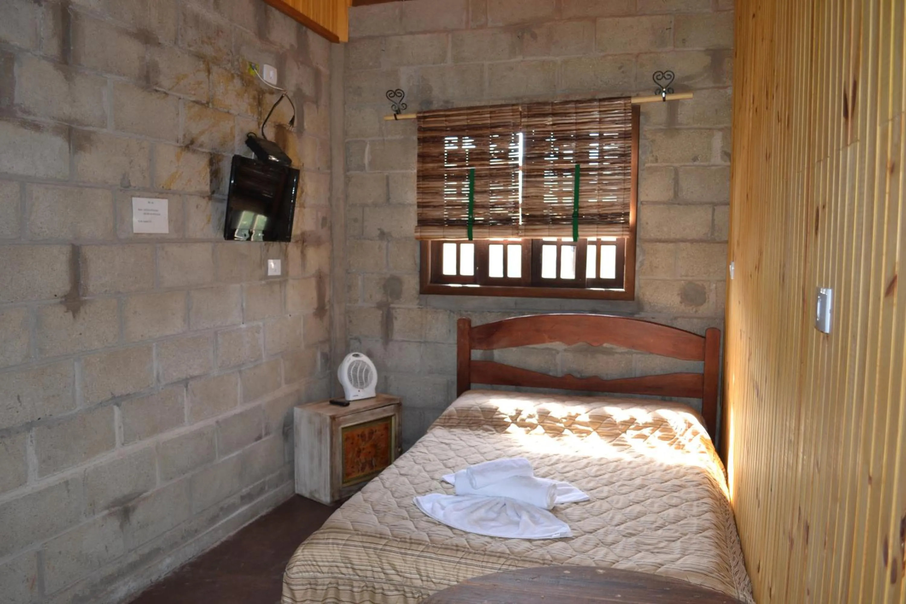 Bed in Pousada Rota dos Pássaros