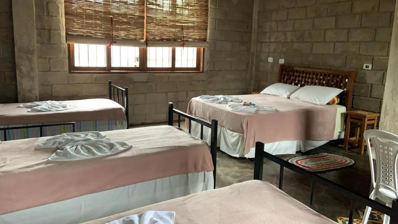 Bed in Pousada Rota dos Pássaros