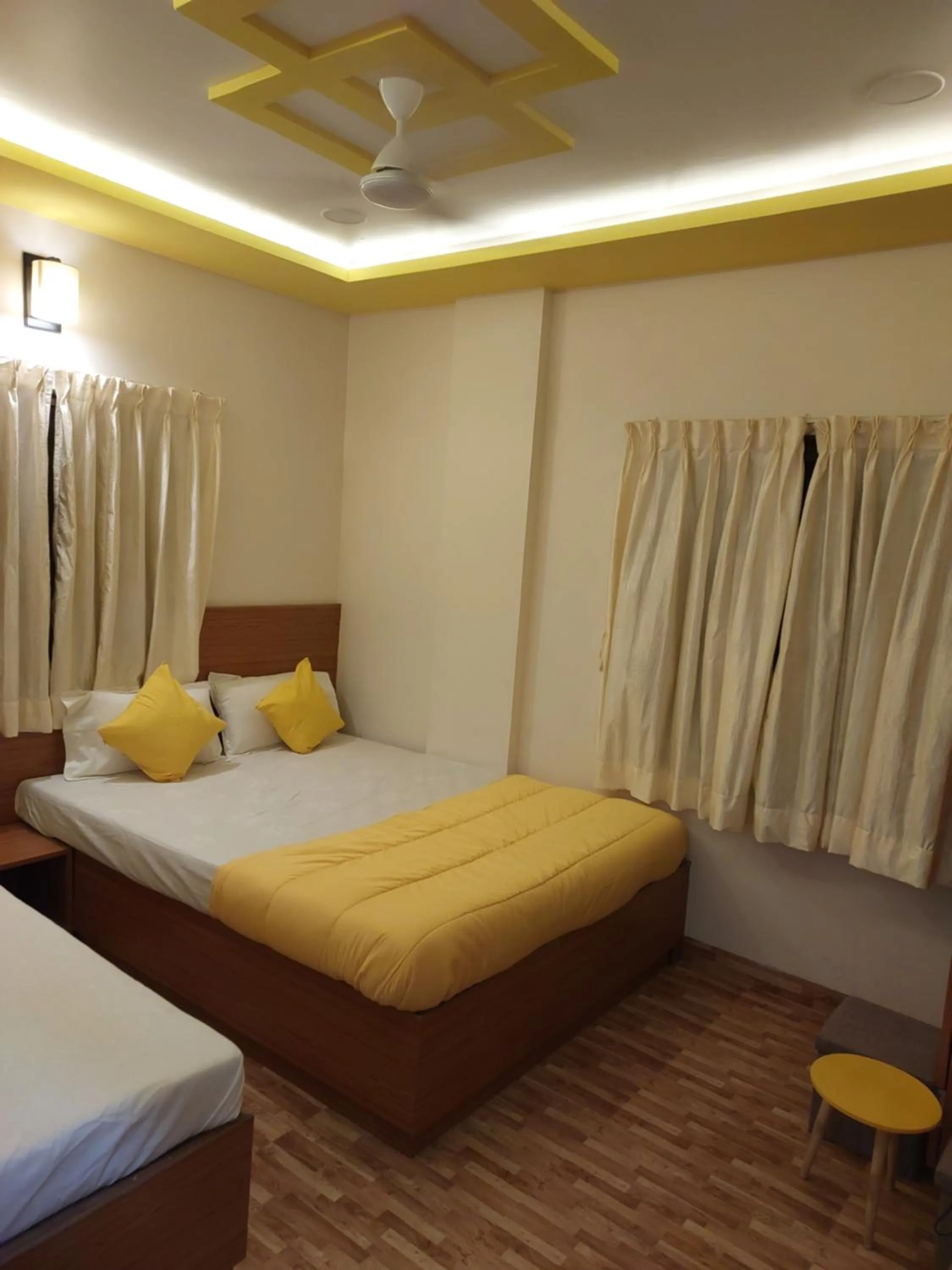 Bed in Hotel Sai Dakshina Inn & The Fern Restaurant