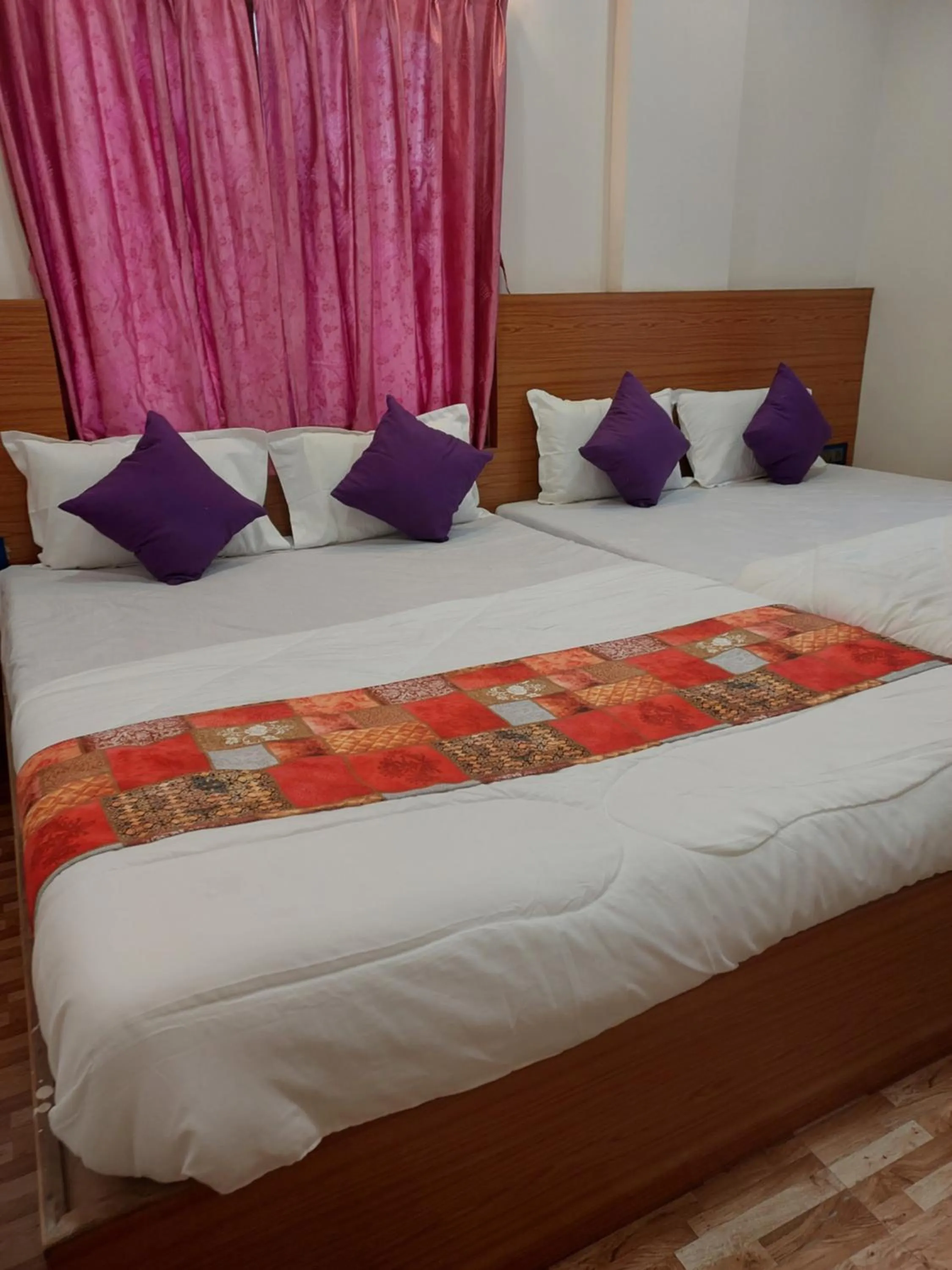 Bed in Hotel Sai Dakshina Inn & The Fern Restaurant