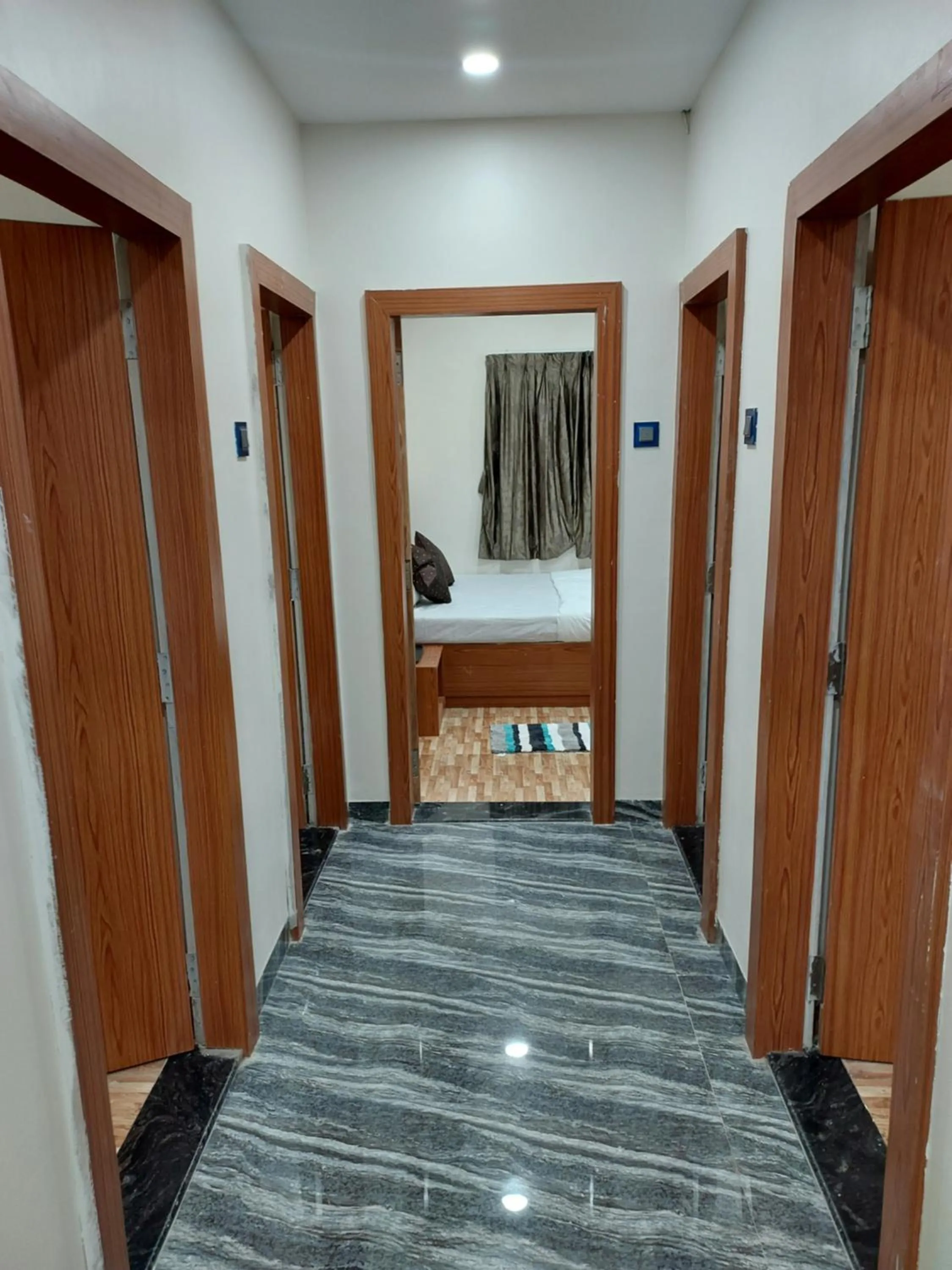 Bed in Hotel Sai Dakshina Inn & The Fern Restaurant