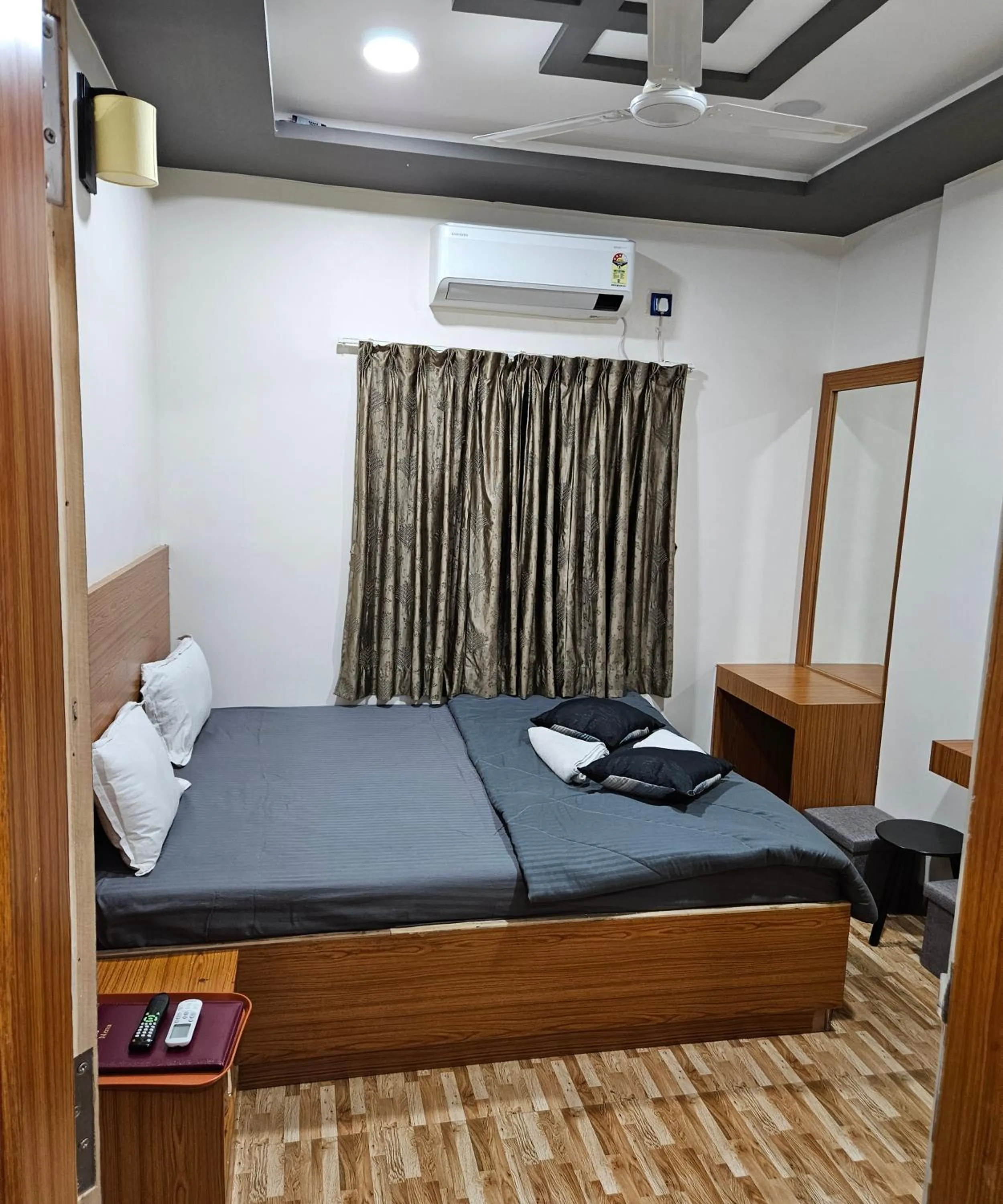 Bed in Hotel Sai Dakshina Inn & The Fern Restaurant