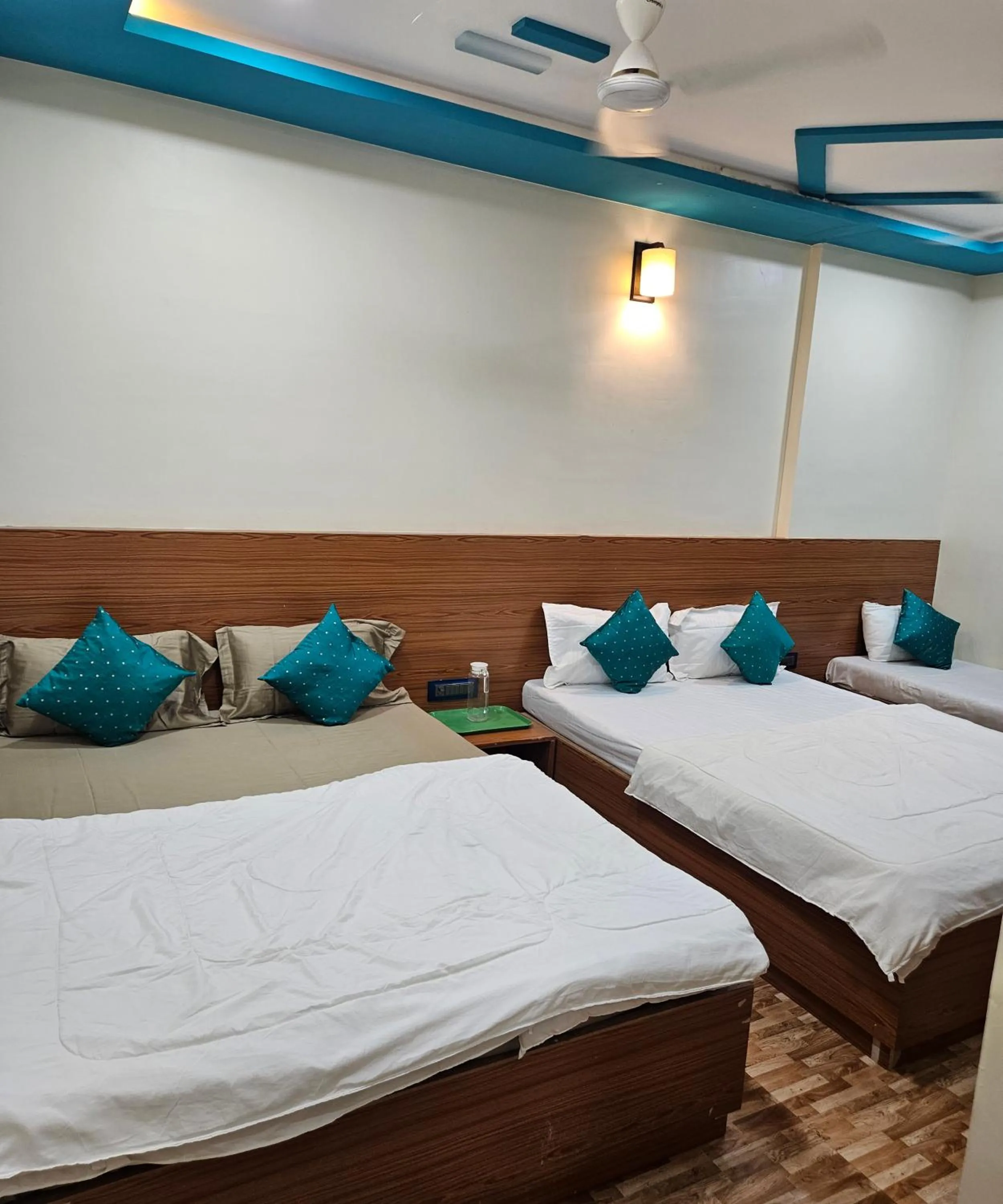 Bed in Hotel Sai Dakshina Inn & The Fern Restaurant