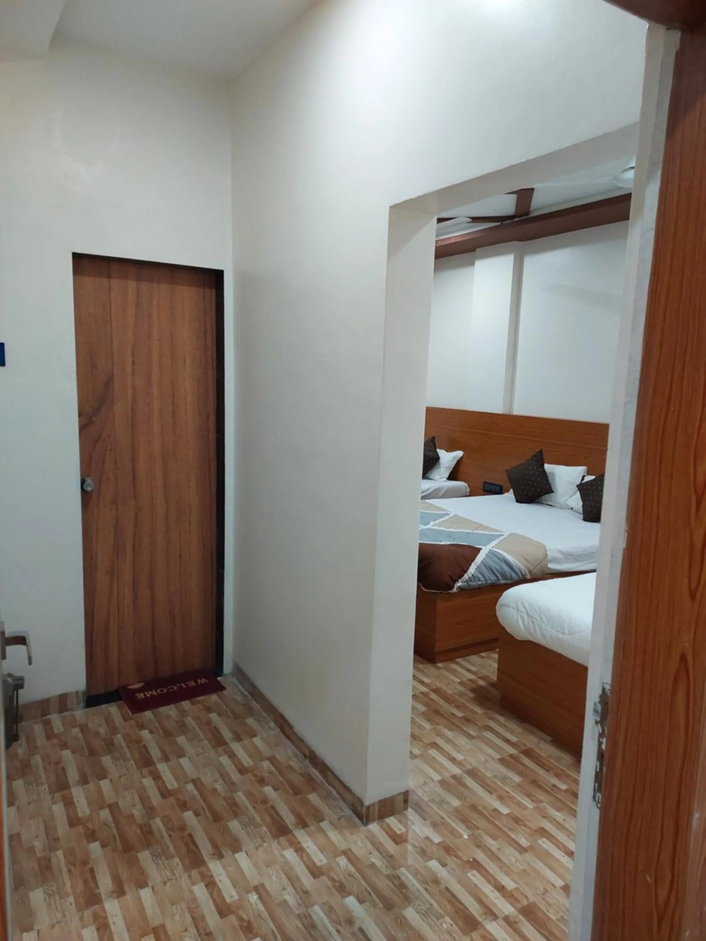 Bed in Hotel Sai Dakshina Inn & The Fern Restaurant