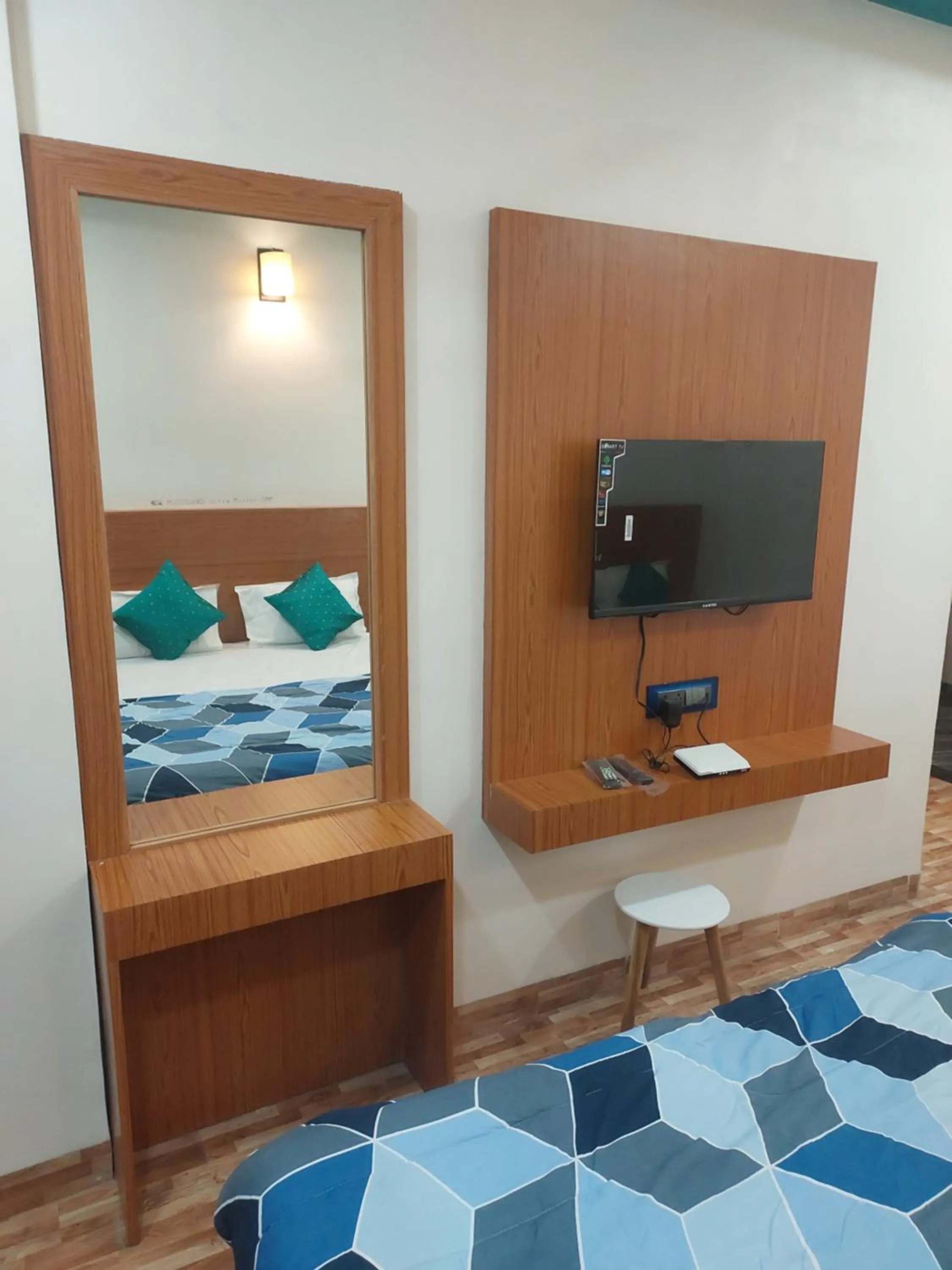 Bed in Hotel Sai Dakshina Inn & The Fern Restaurant