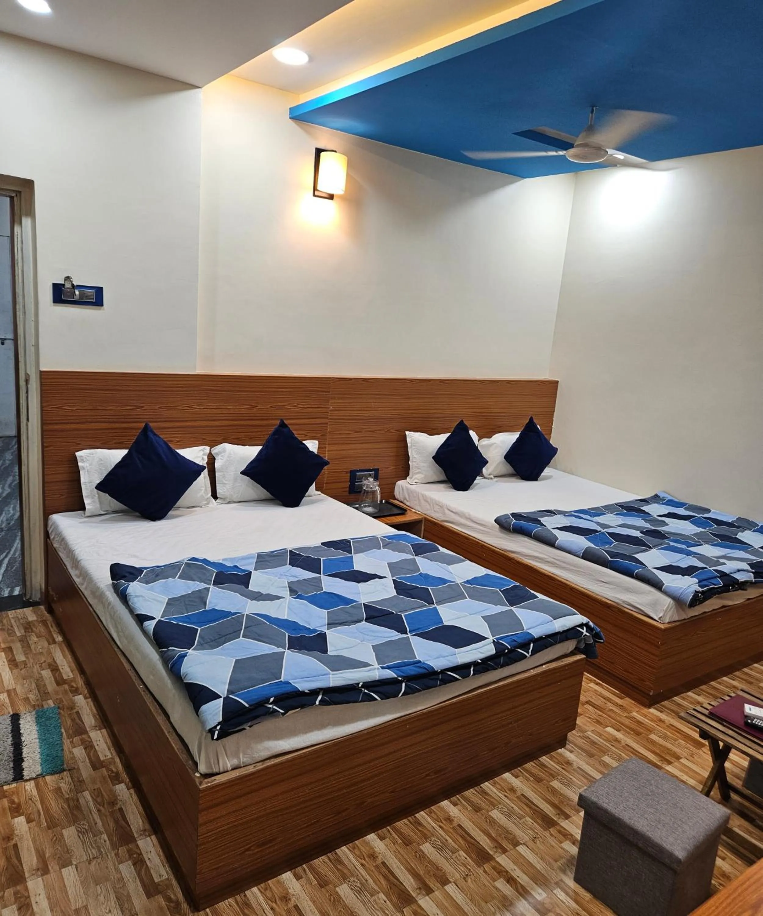 Bed in Hotel Sai Dakshina Inn & The Fern Restaurant