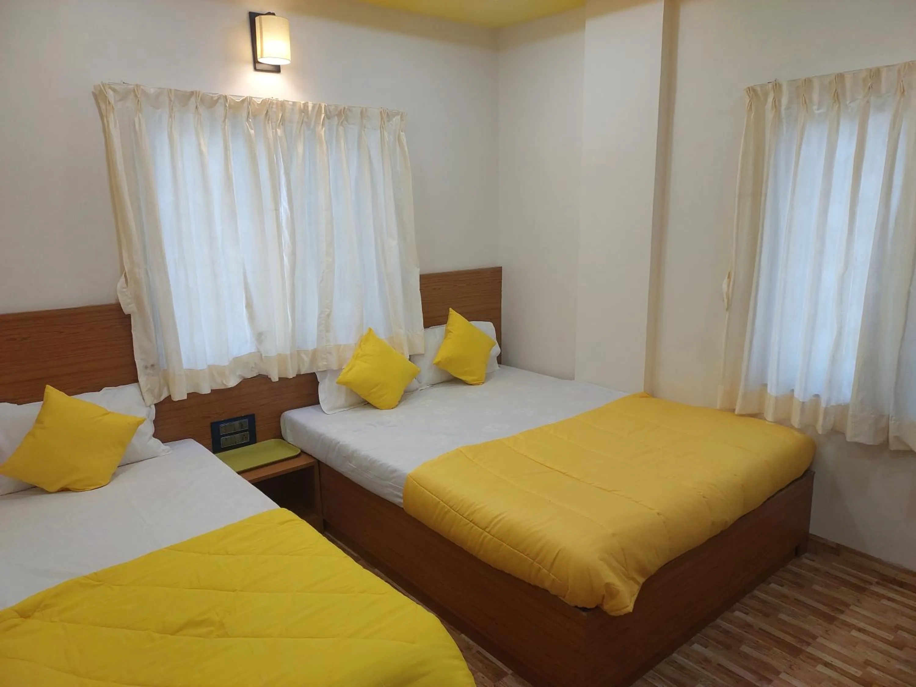 Bed in Hotel Sai Dakshina Inn & The Fern Restaurant