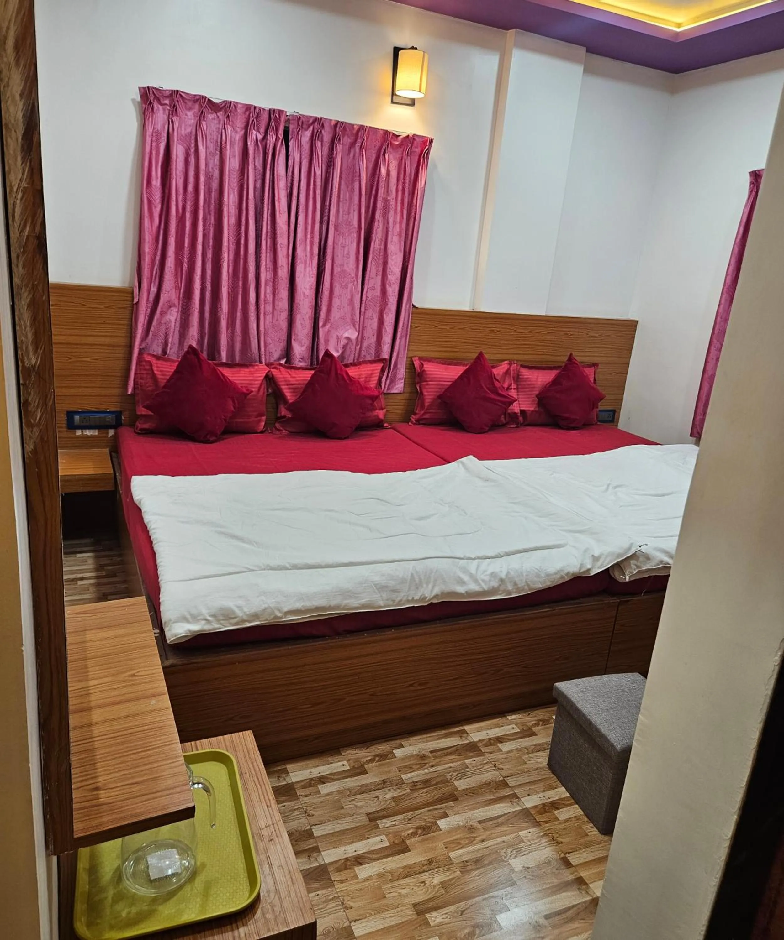 Bed in Hotel Sai Dakshina Inn & The Fern Restaurant