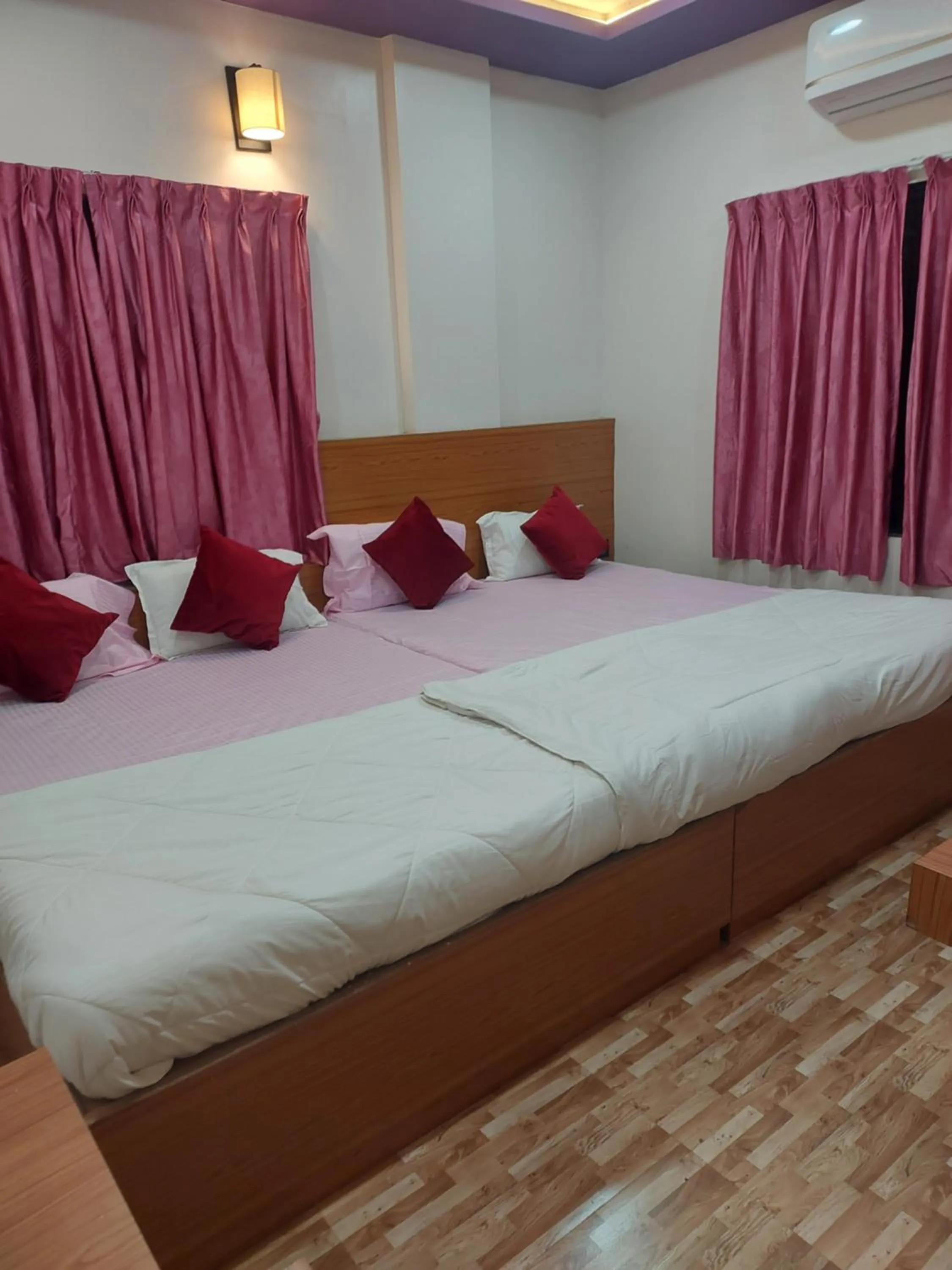 Bed in Hotel Sai Dakshina Inn & The Fern Restaurant