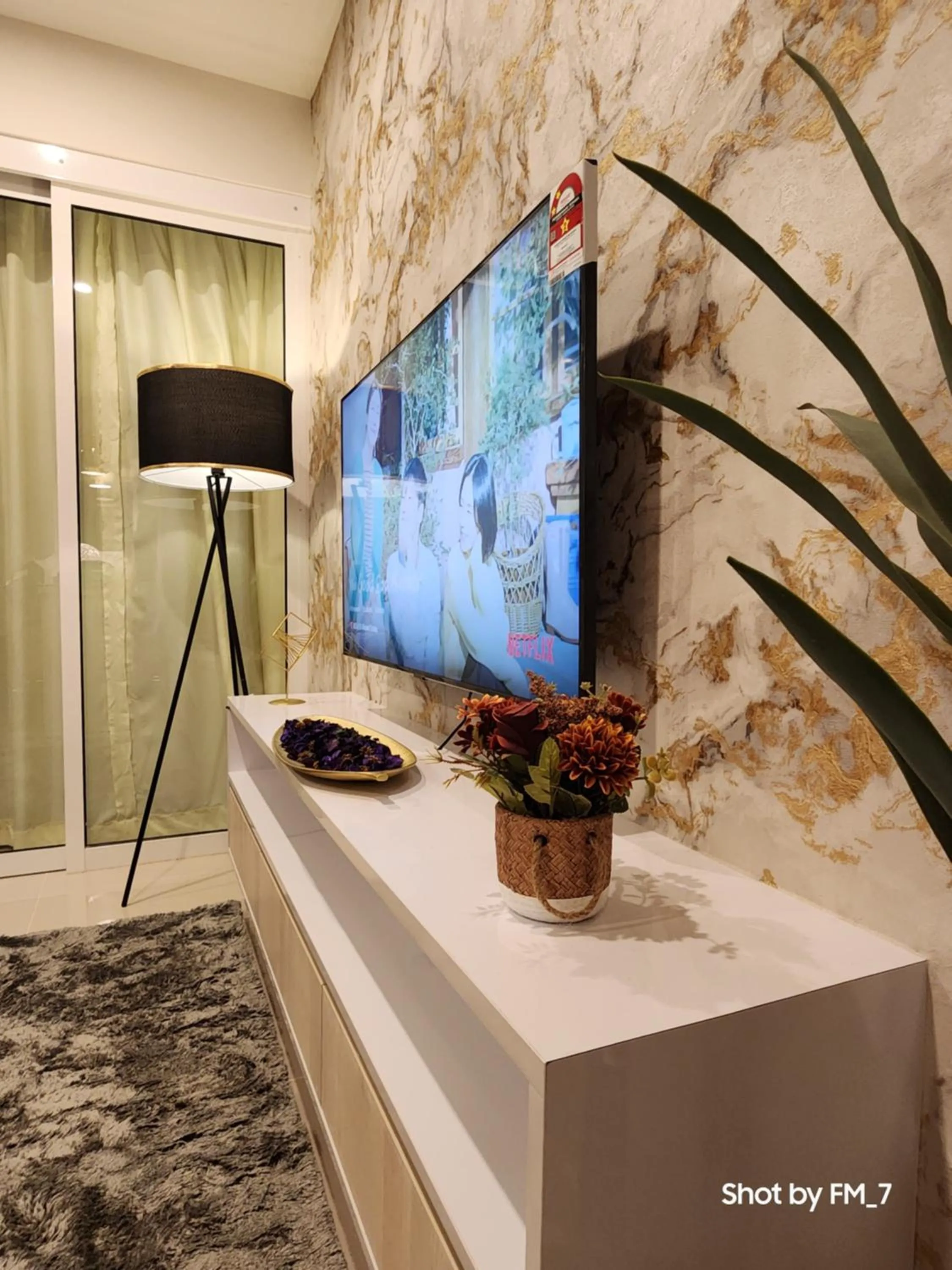 Communal lounge/ TV room in Seaview Luxury Suites at The Shore Kota Kinabalu