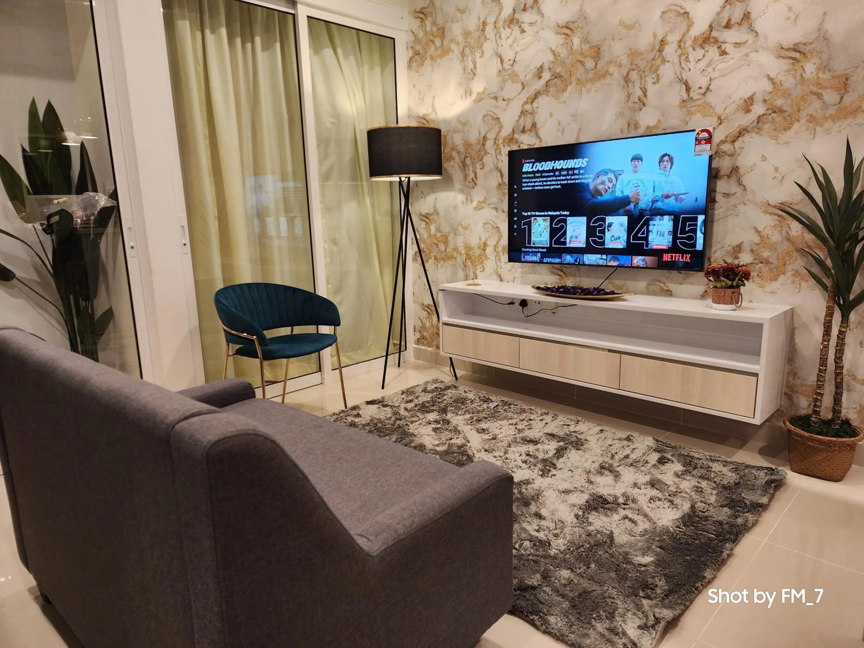 Communal lounge/ TV room in Seaview Luxury Suites at The Shore Kota Kinabalu