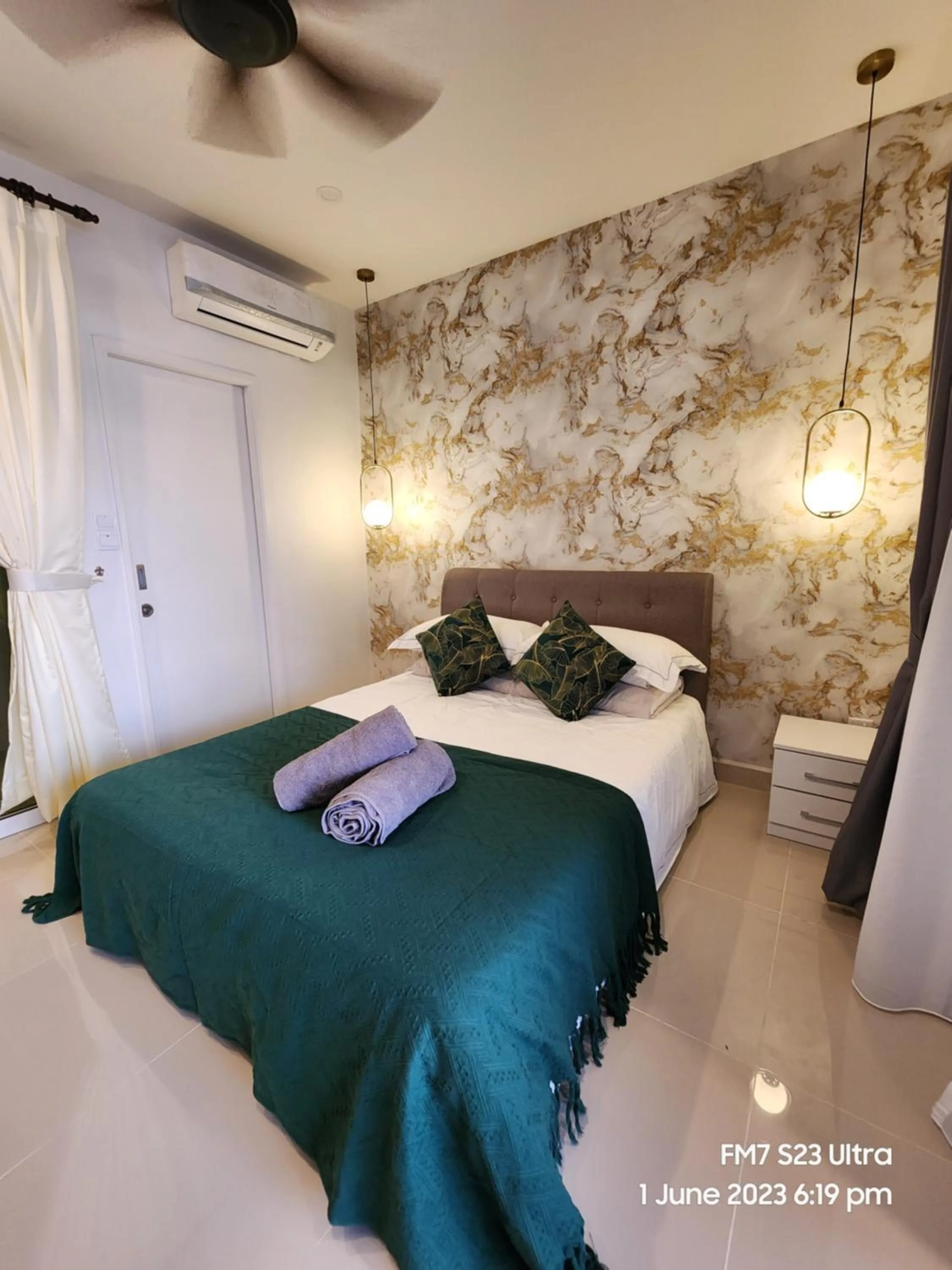 Bed in Seaview Luxury Suites at The Shore Kota Kinabalu