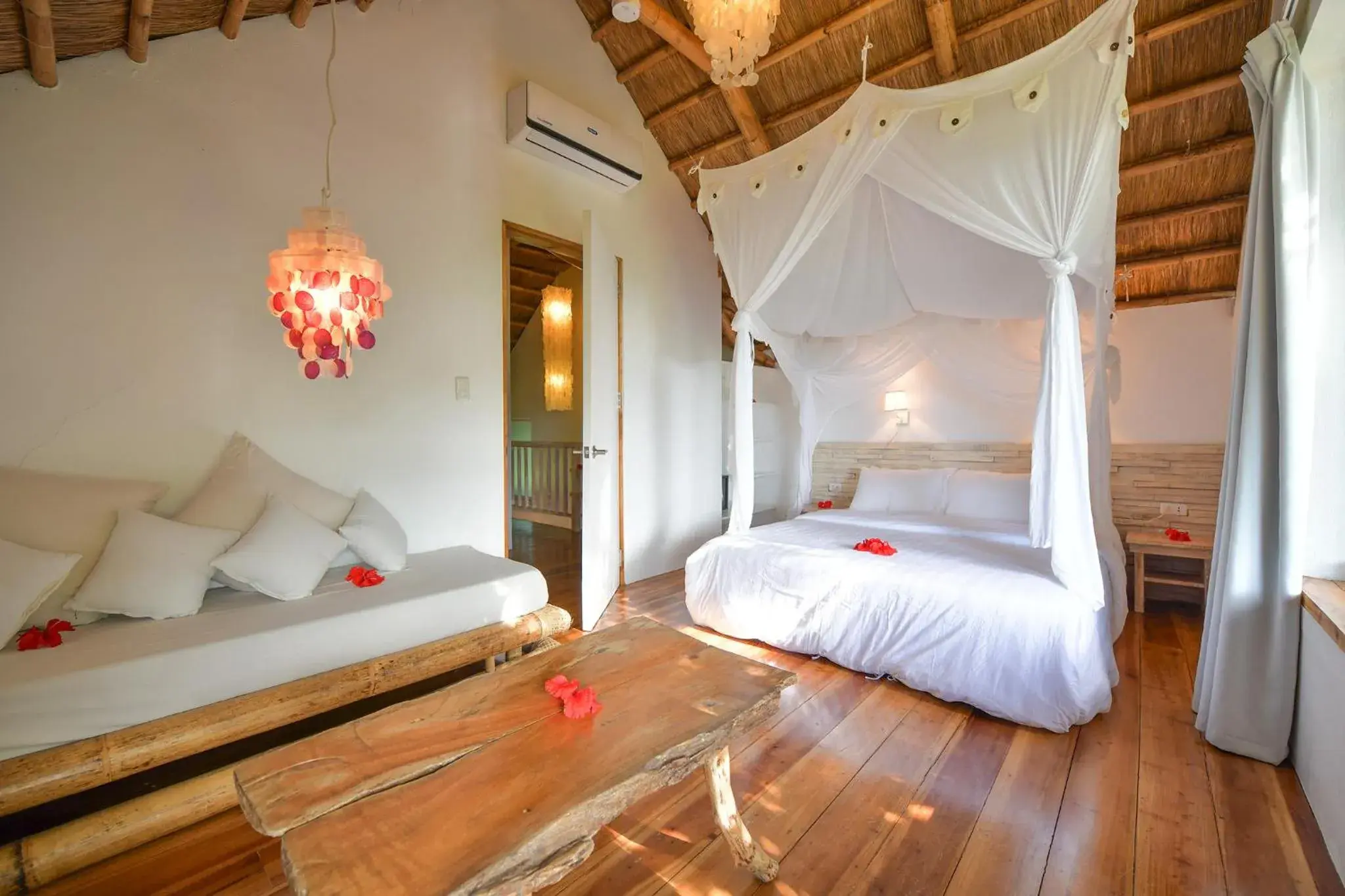 Seating area, Bed in Diniview Villa Resort Seating area, Bed in Diniview Villa Resort