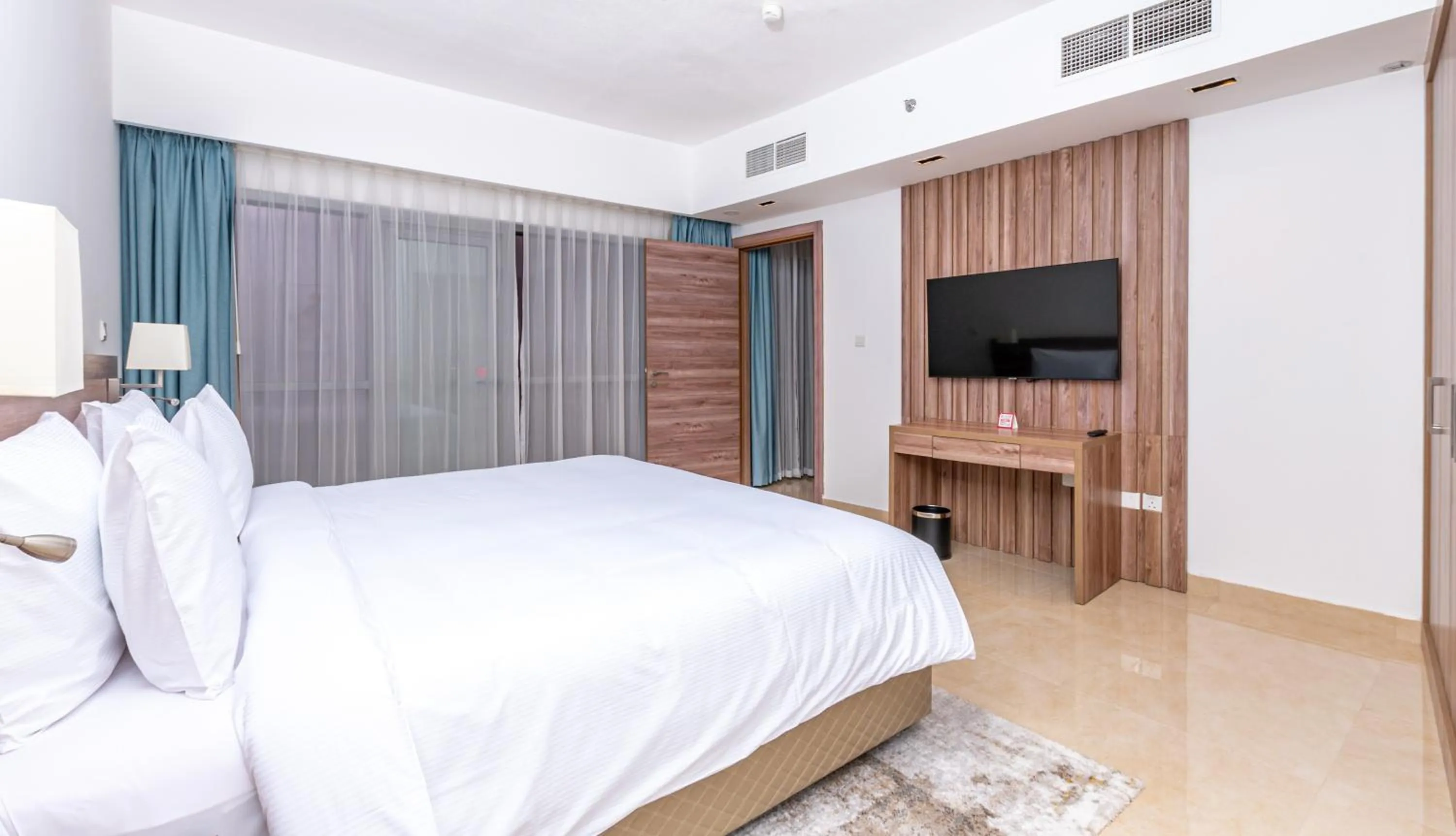 Bed in Pyramisa Hotel Apartments