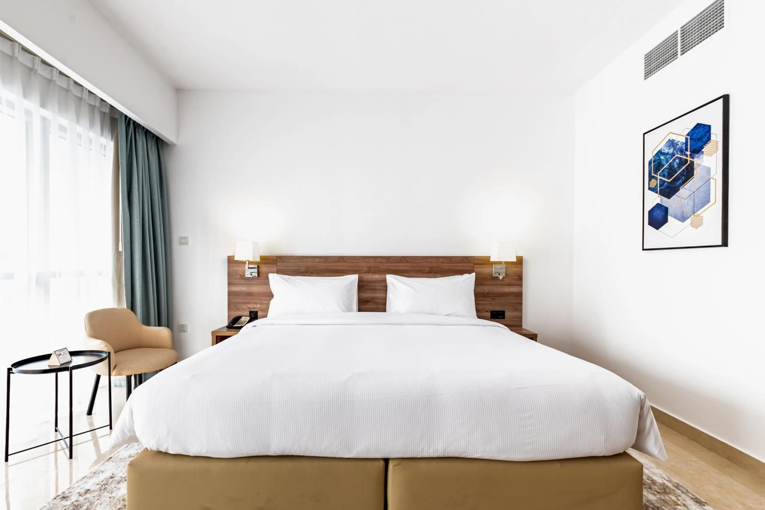 Bed in Pyramisa Hotel Apartments