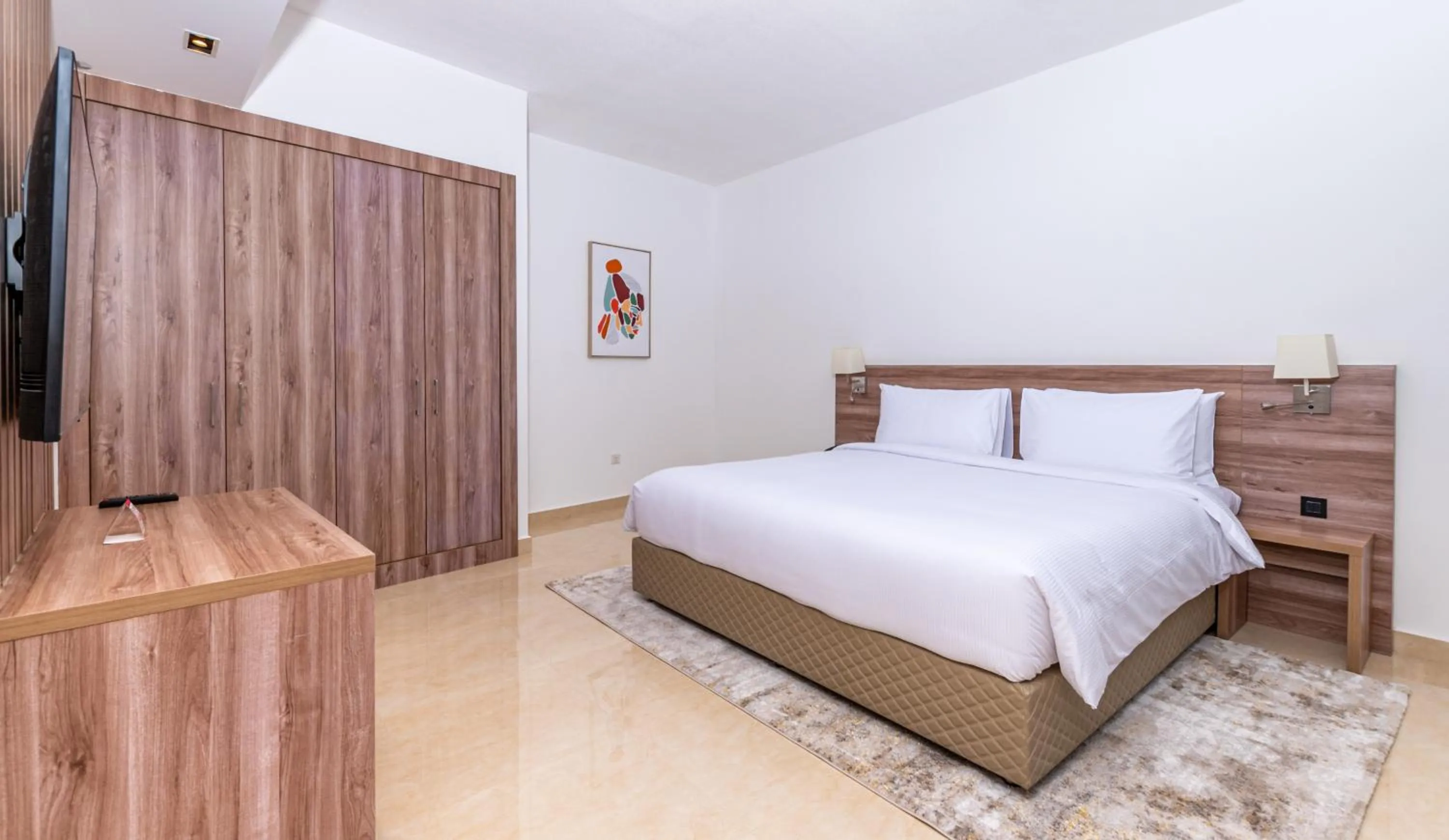 Bed in Pyramisa Hotel Apartments