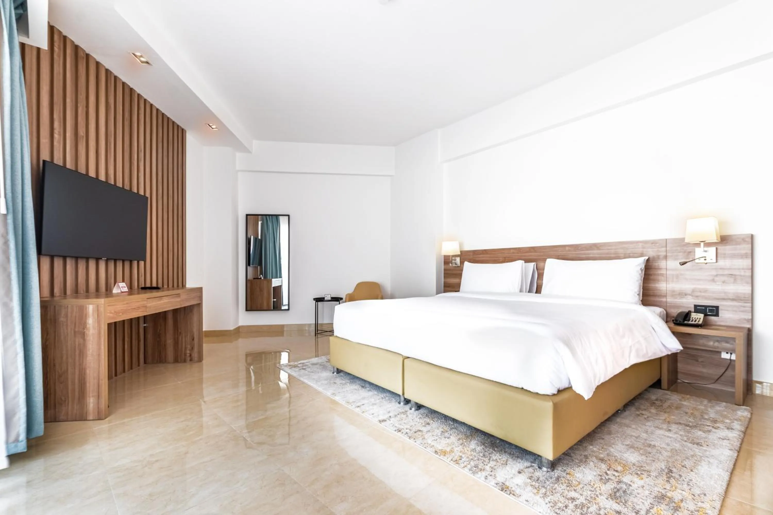 Bed in Pyramisa Hotel Apartments