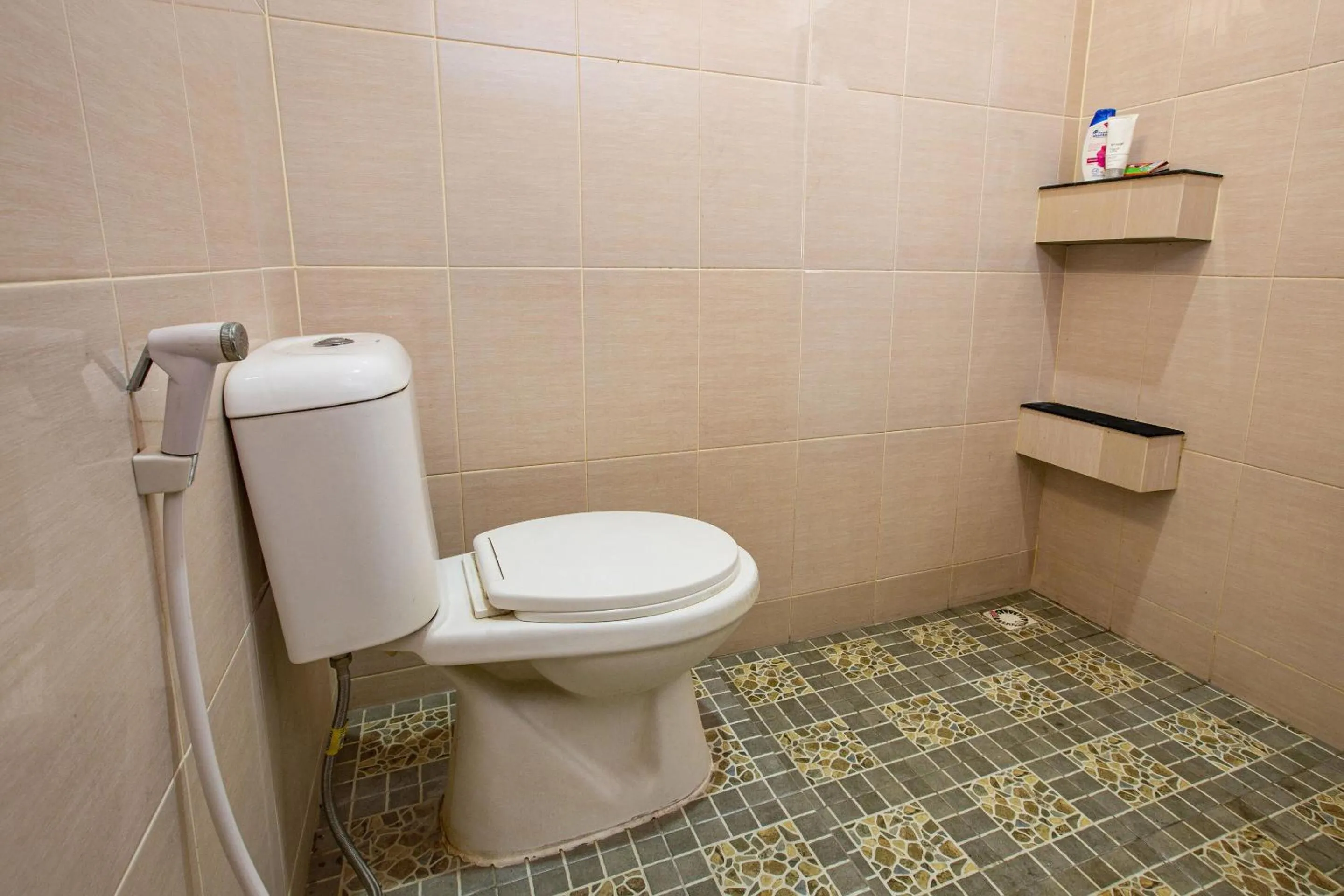 Bedroom in Hotel O Homestay Romauli Kampung Radja