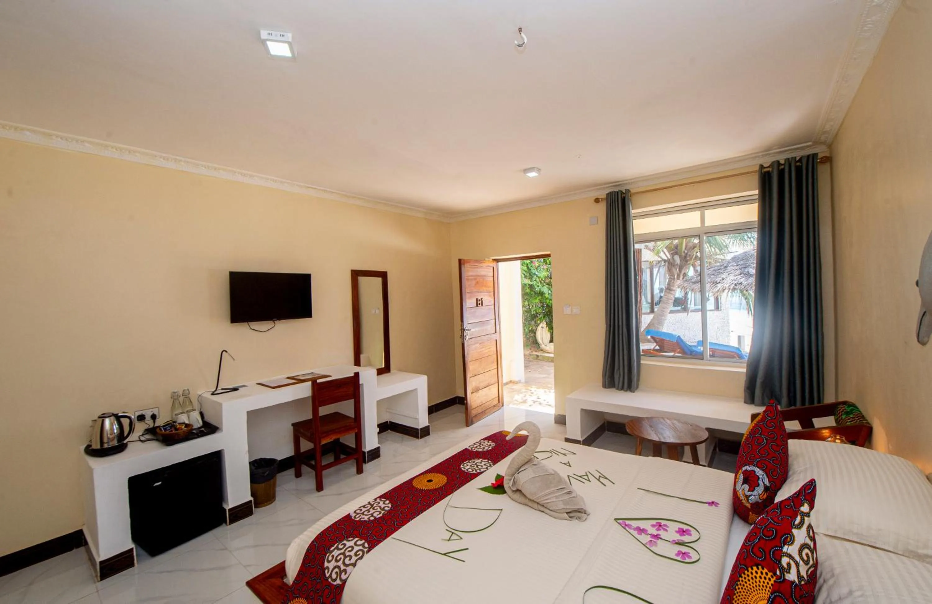 Bed in Double A Nungwi Beach Hotel